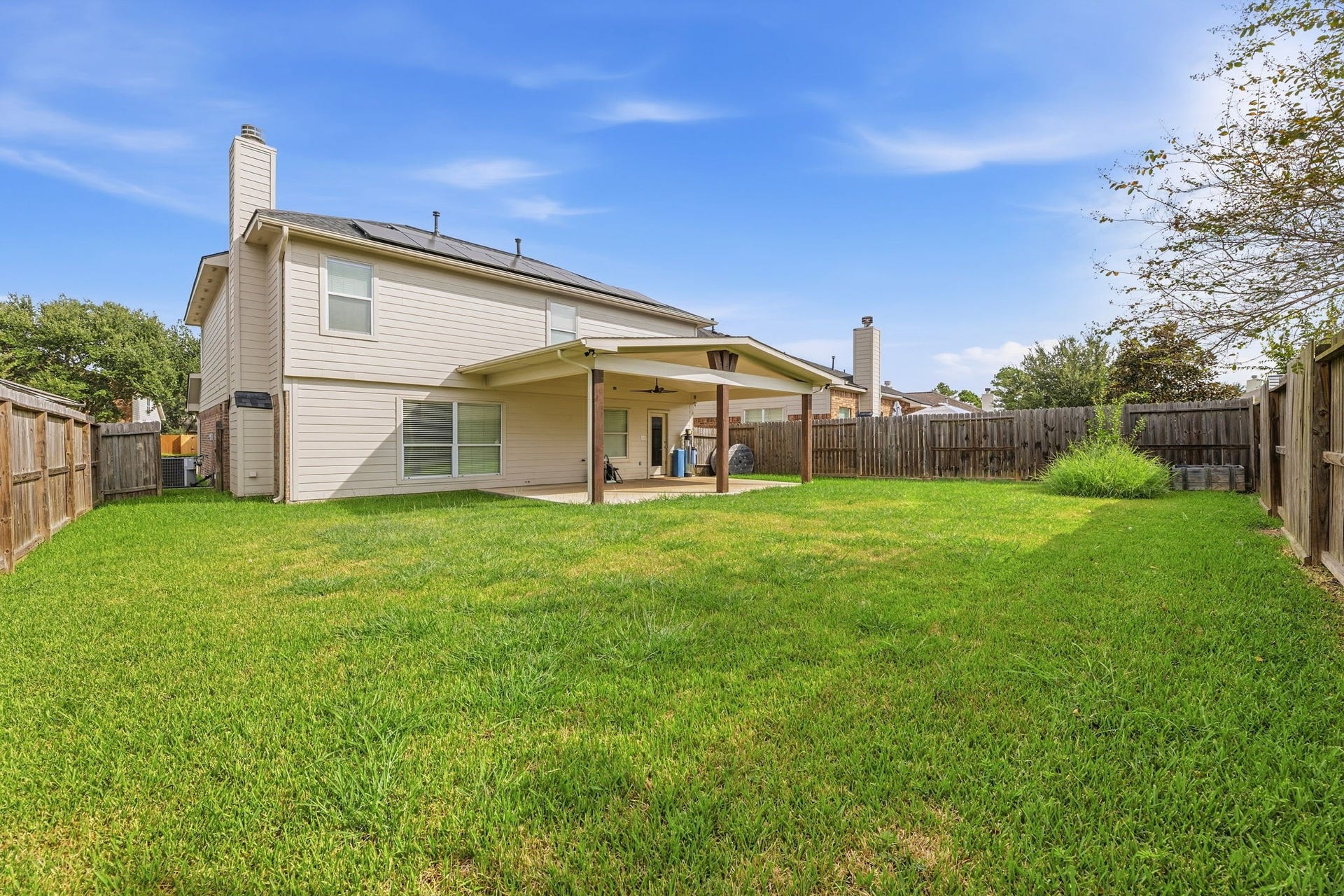 A wide, level lawn with lots of room to play, garden, or entertain.