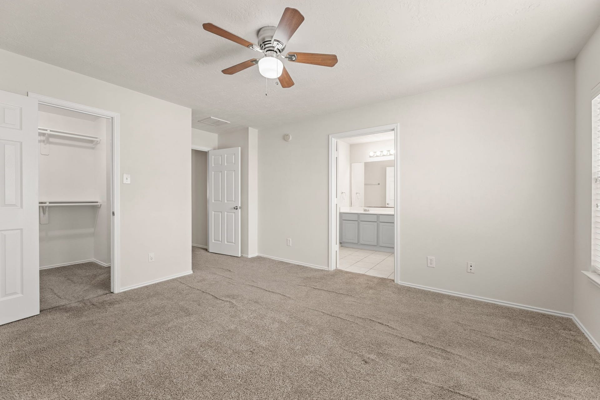 Another angle shows the walk-in closet and the doorway to the upstairs hall.
