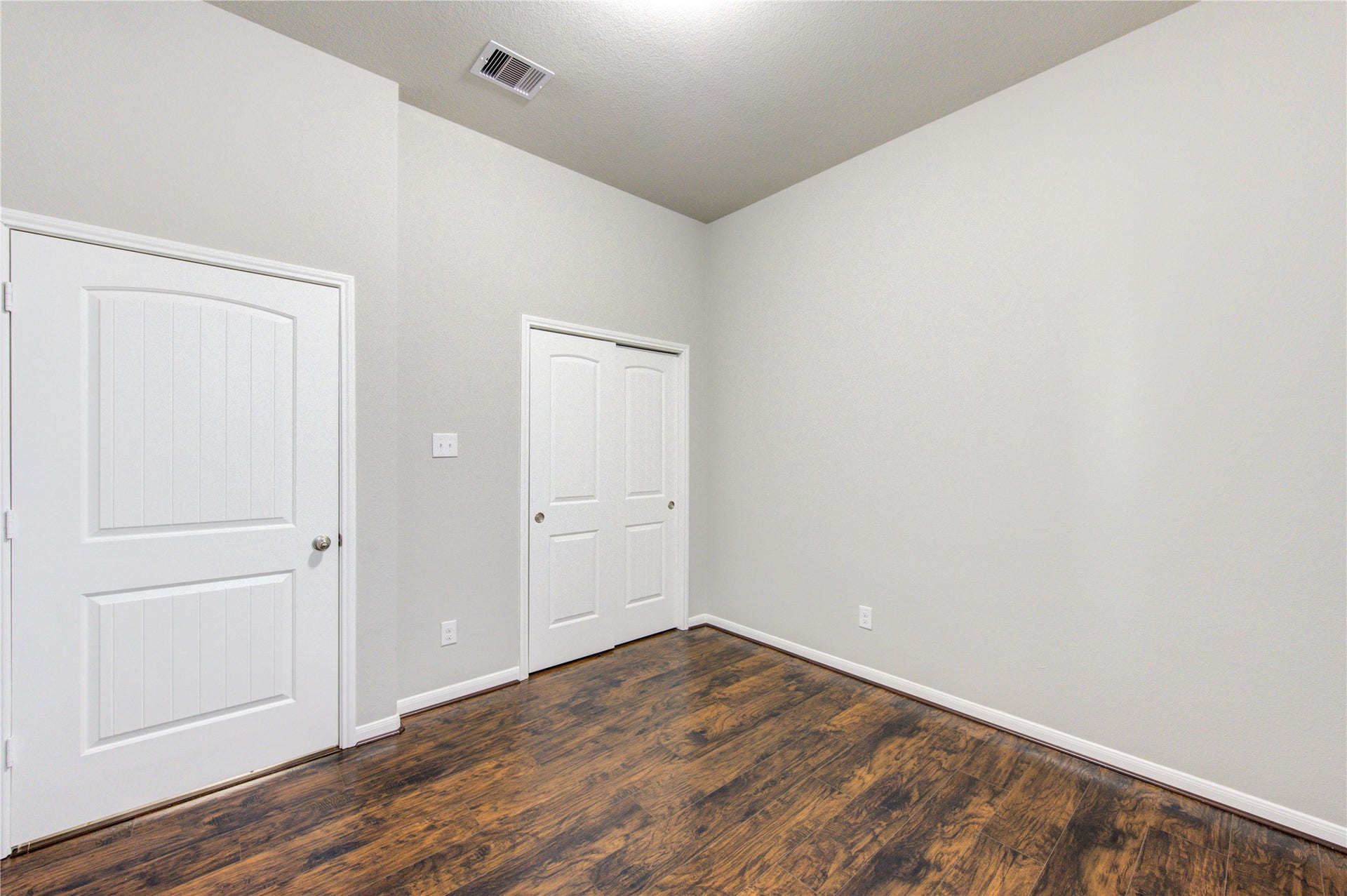 5314 Silver Ledge Drive, Katy, TX 77493 Charming single-story brick home with a two-car garage. Features a well-maintained front yard with mature trees and shrubs. The entrance is inviting with a covered porch and arched doorway, offering great curb appeal.