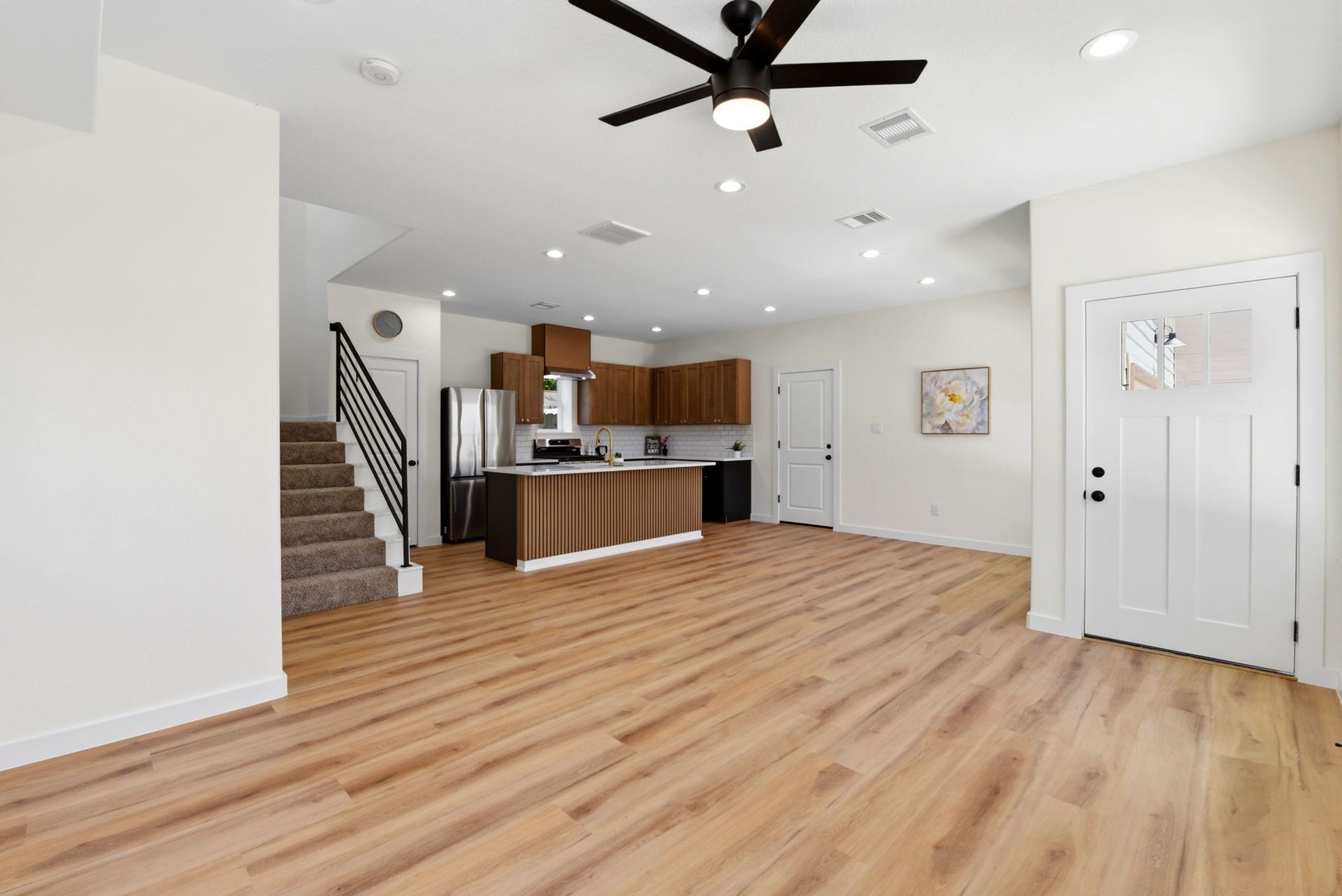 6117 Haight Street, Houston, TX 77028 Modern open-concept living space with lots of natural light and recessed lighting.