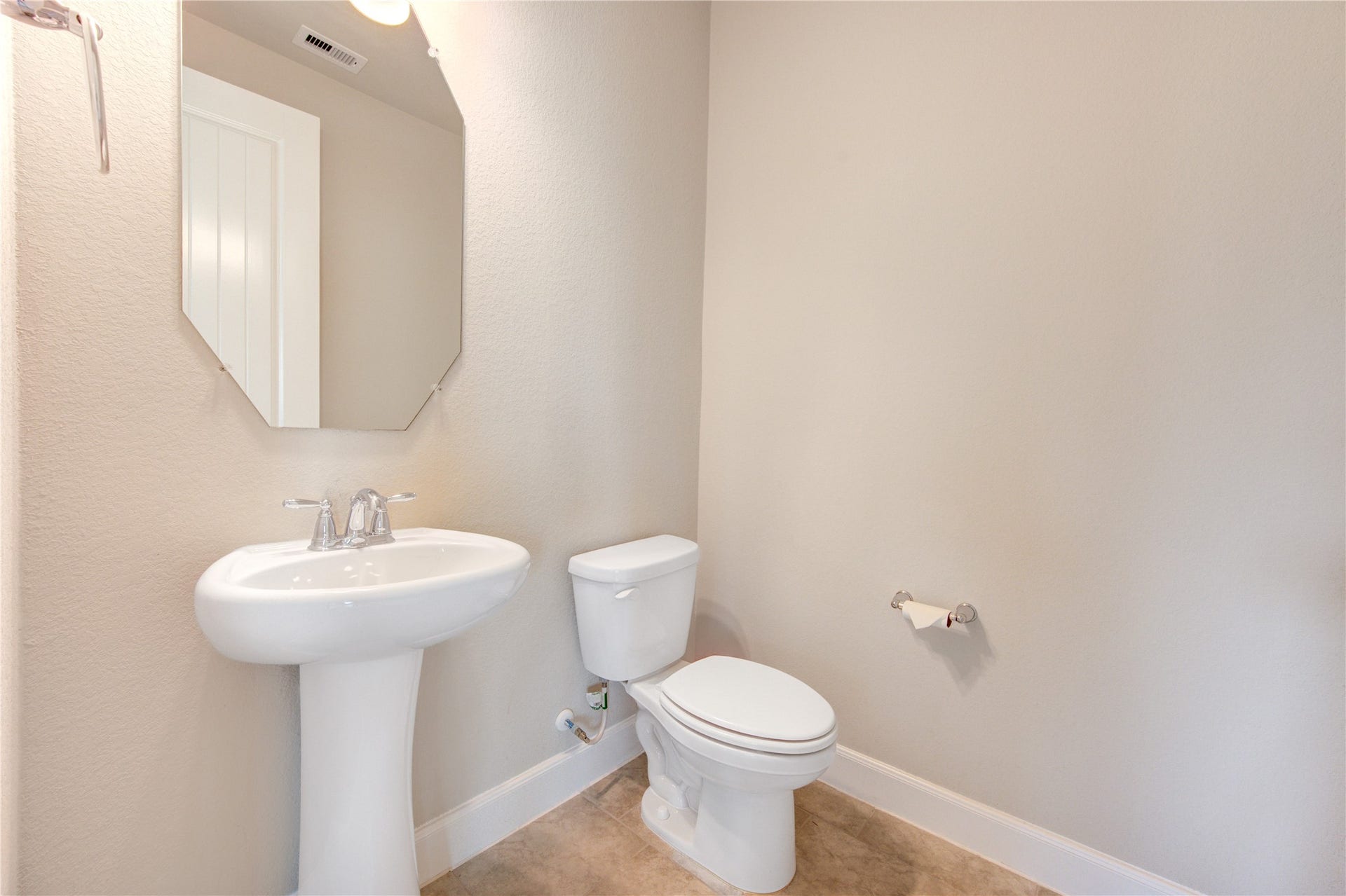 2334 Green Kale Drive, Richmond, TX 77406 View of the half bath, conveniently located off the living area.