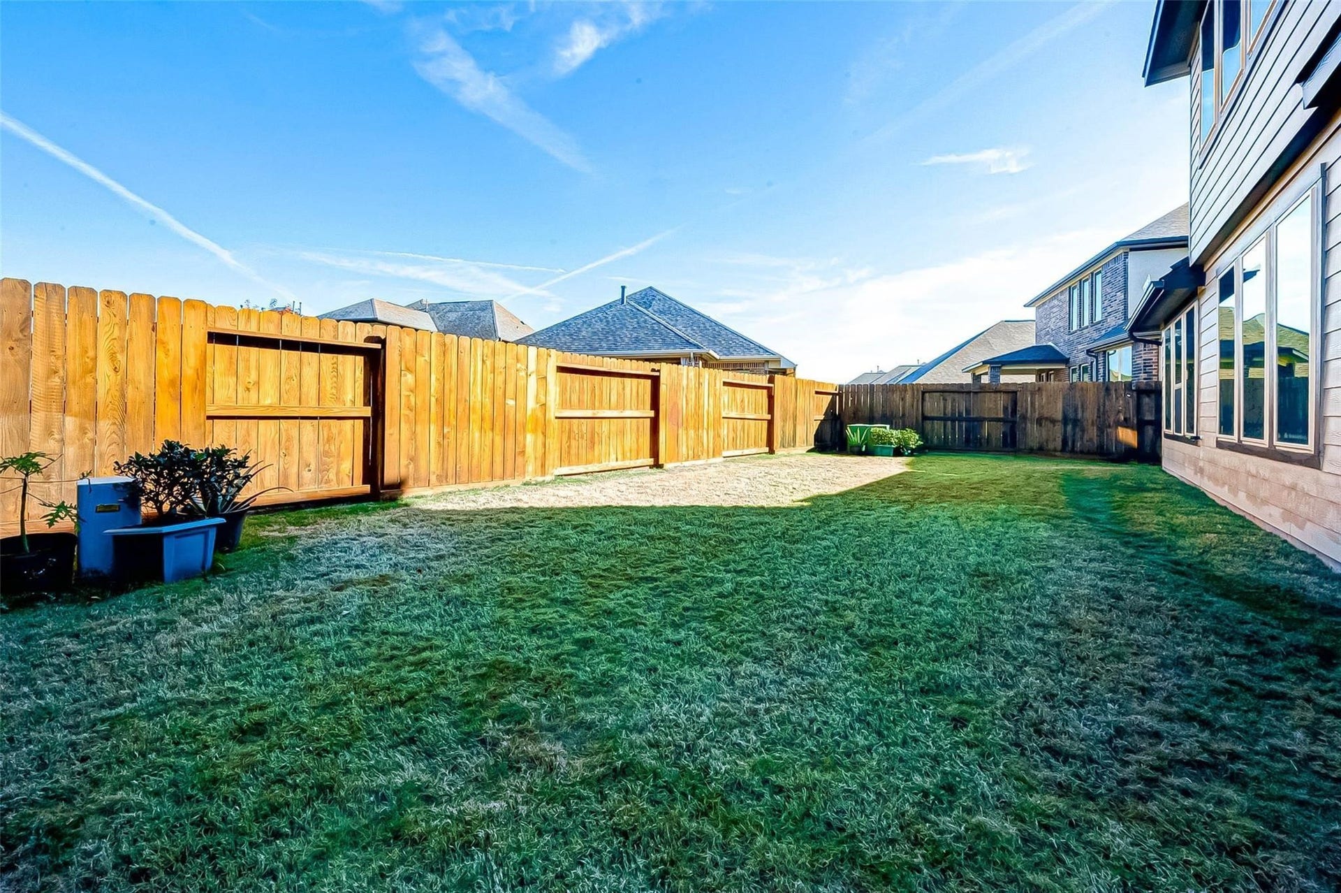 23514 San Ricci Court, Richmond, TX 77406 Another view of the spacious fenced backyard with plenty of room for outdoor activities.