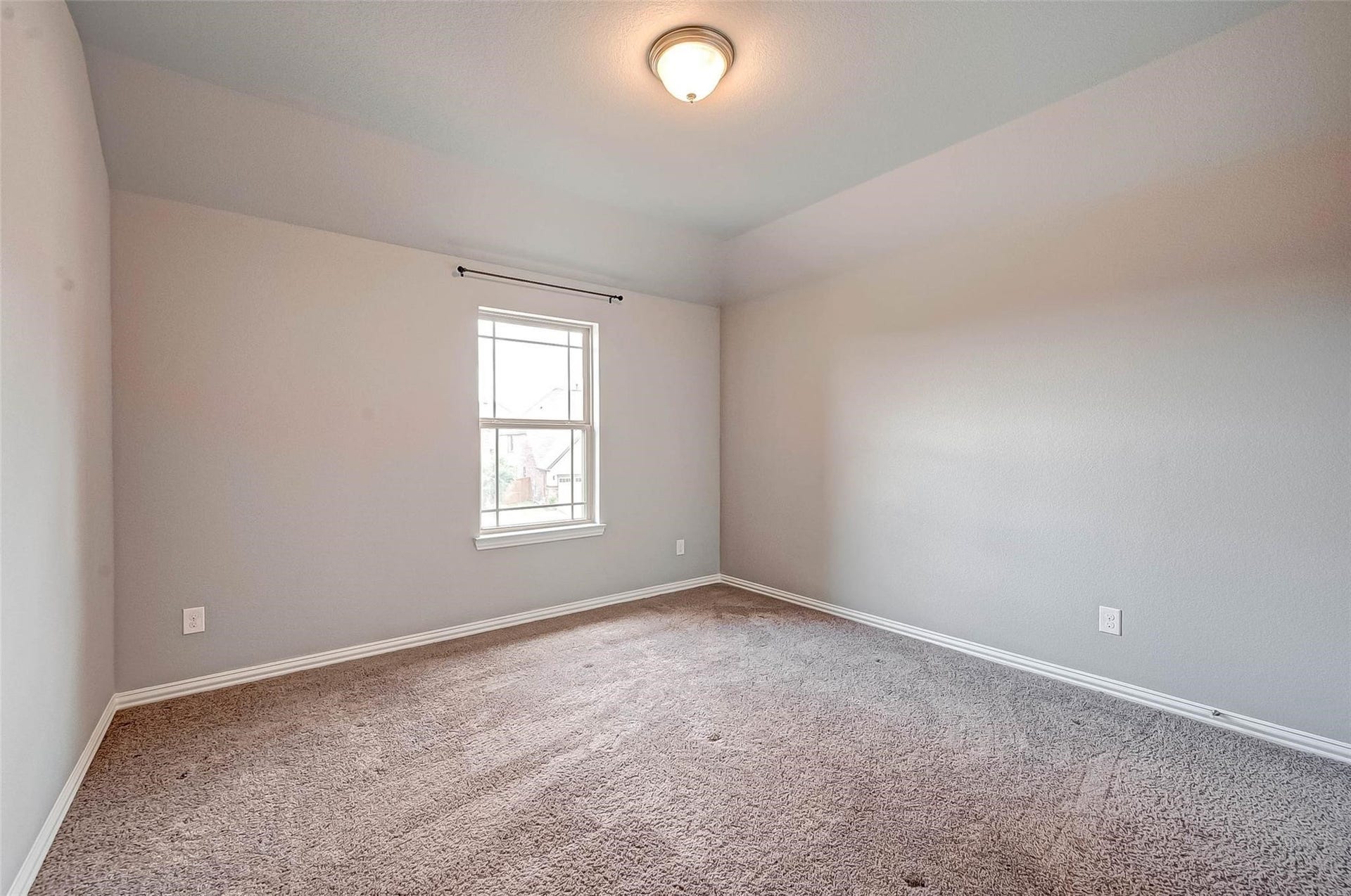 23514 San Ricci Court, Richmond, TX 77406 Second bedroom with carpet flooring and natural light.