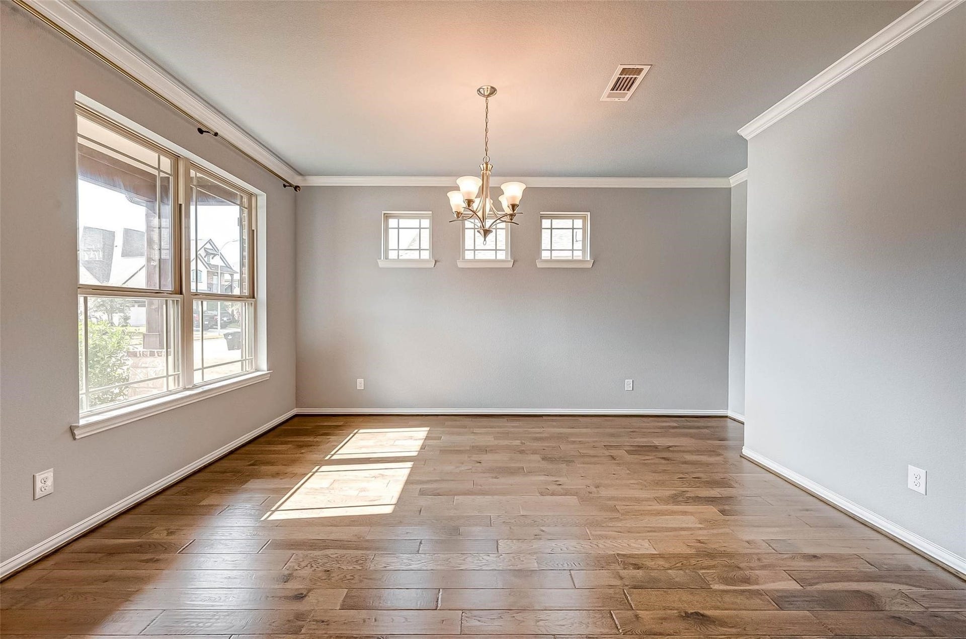 23514 San Ricci Court, Richmond, TX 77406 Step inside to the formal dining area, featuring wood flooring and plenty of natural light.