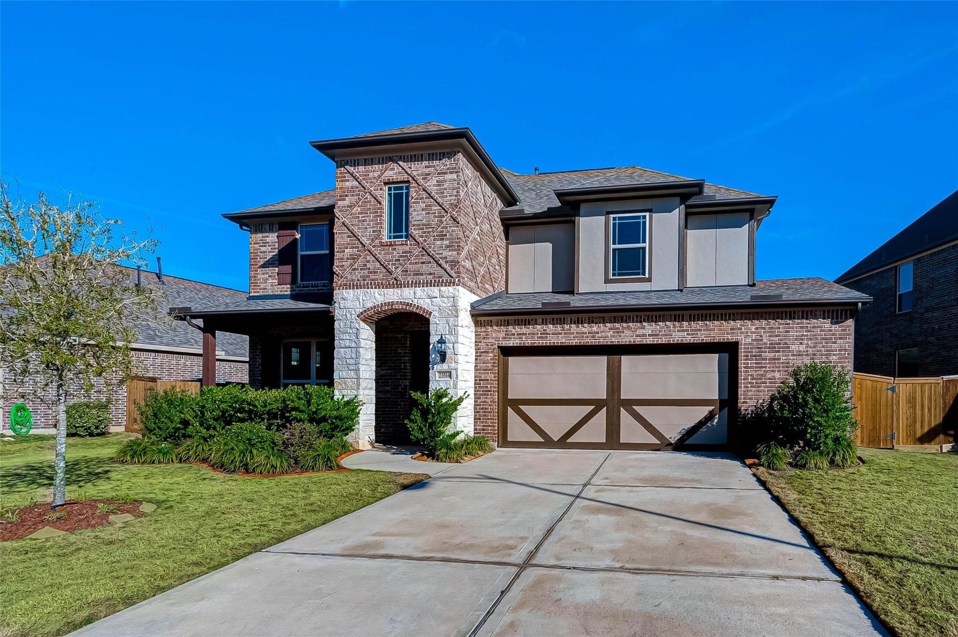 23514 San Ricci Court, Richmond, TX 77406 Welcome to 23514 San Ricci Court, featuring an attractive two-story exterior, landscaped front yard, and attached two-car garage.