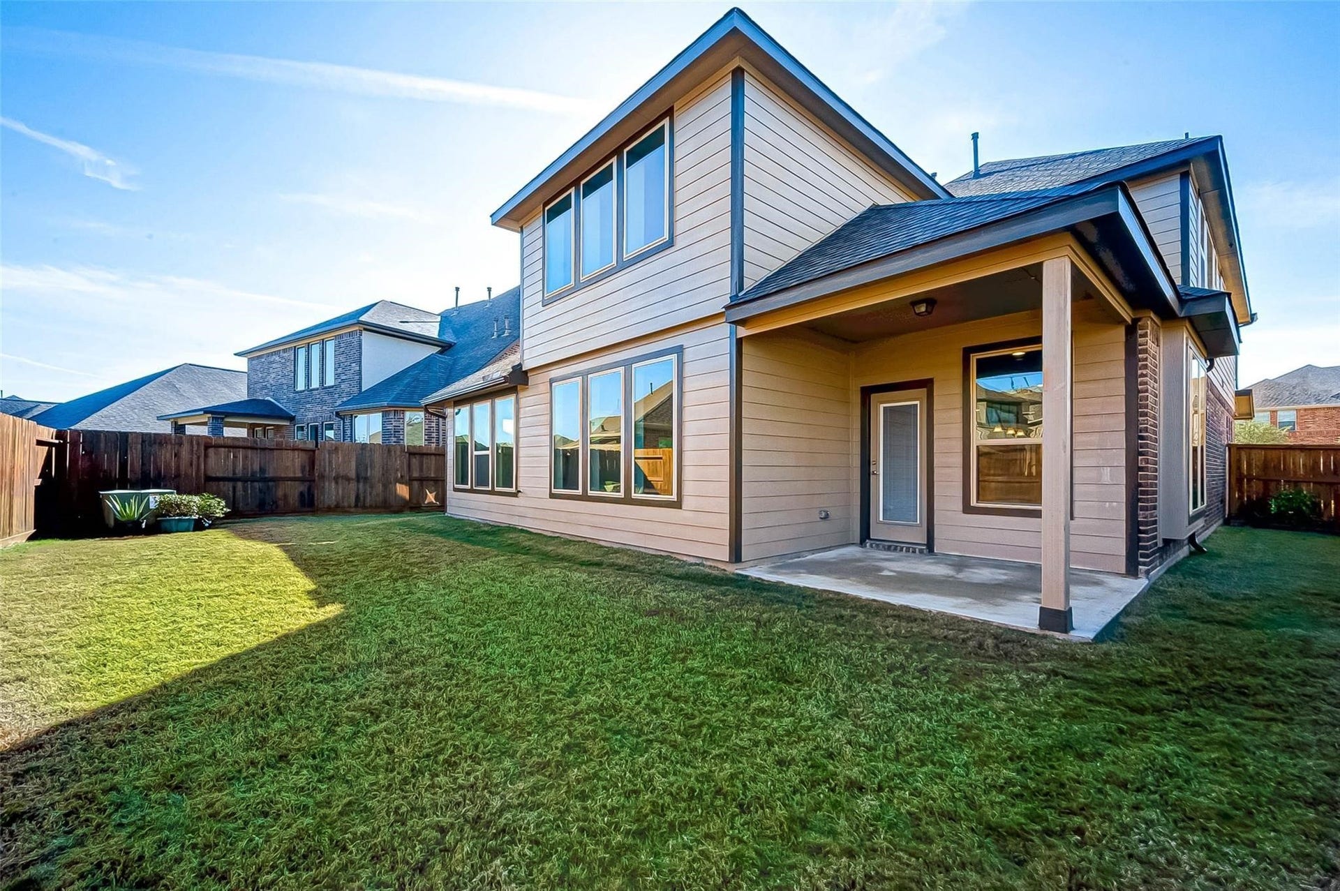 23514 San Ricci Court, Richmond, TX 77406 Spacious fenced backyard featuring a covered patio with plenty of room for outdoor enjoyment.