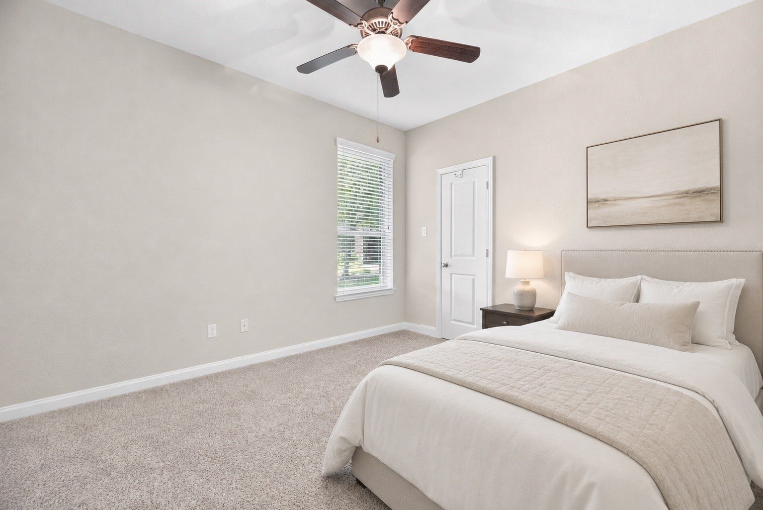 First floor guest room with a ceiling fan and large closet. *virtually staged*
