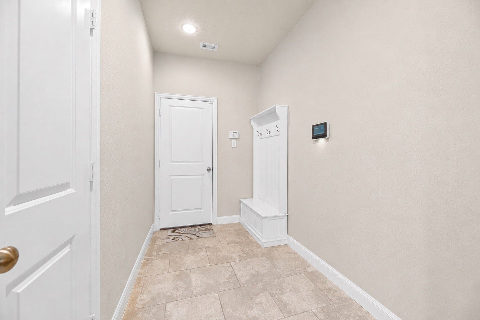 Mud area through the garage entry.