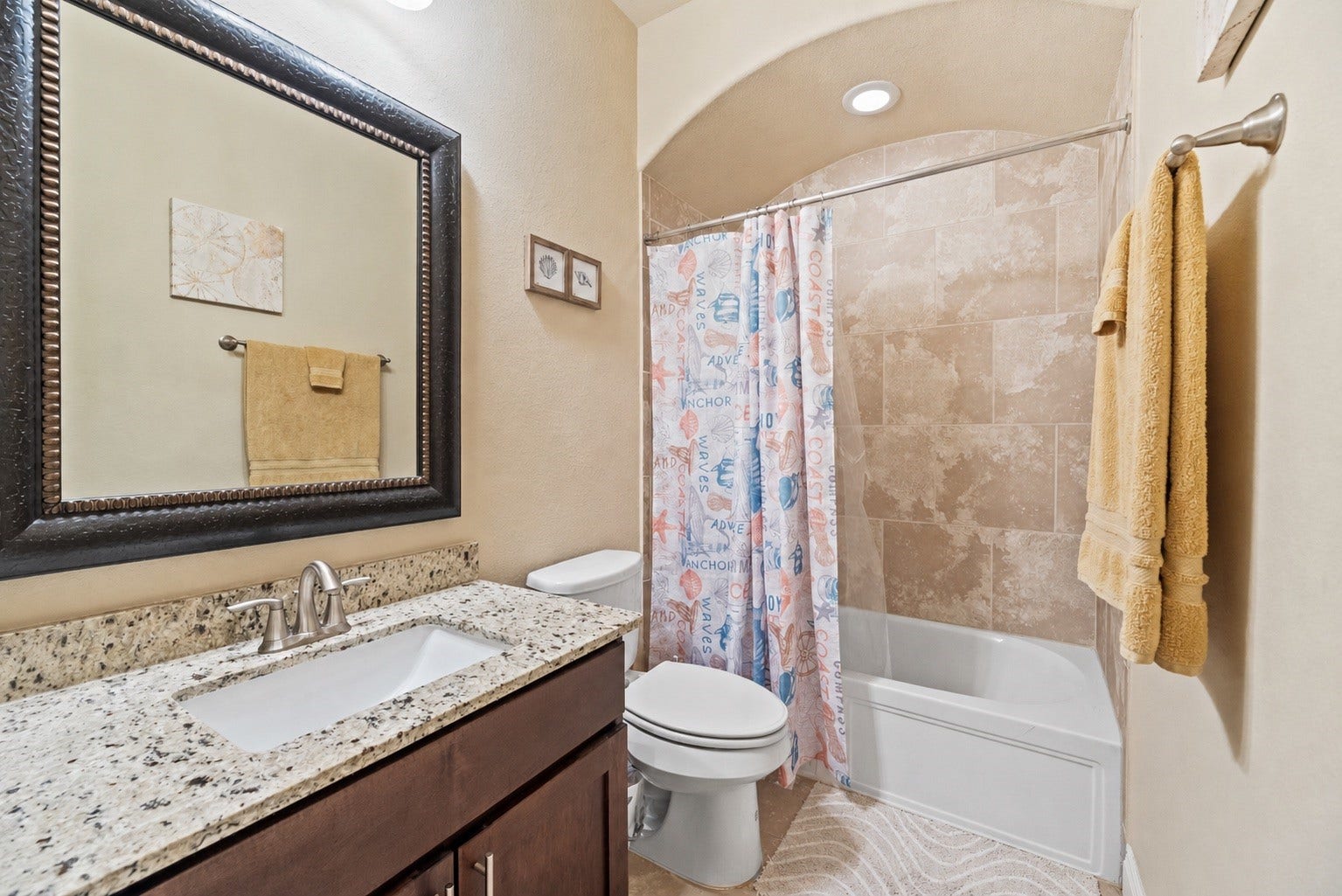 Secondary bathroom located downstairs for guests.