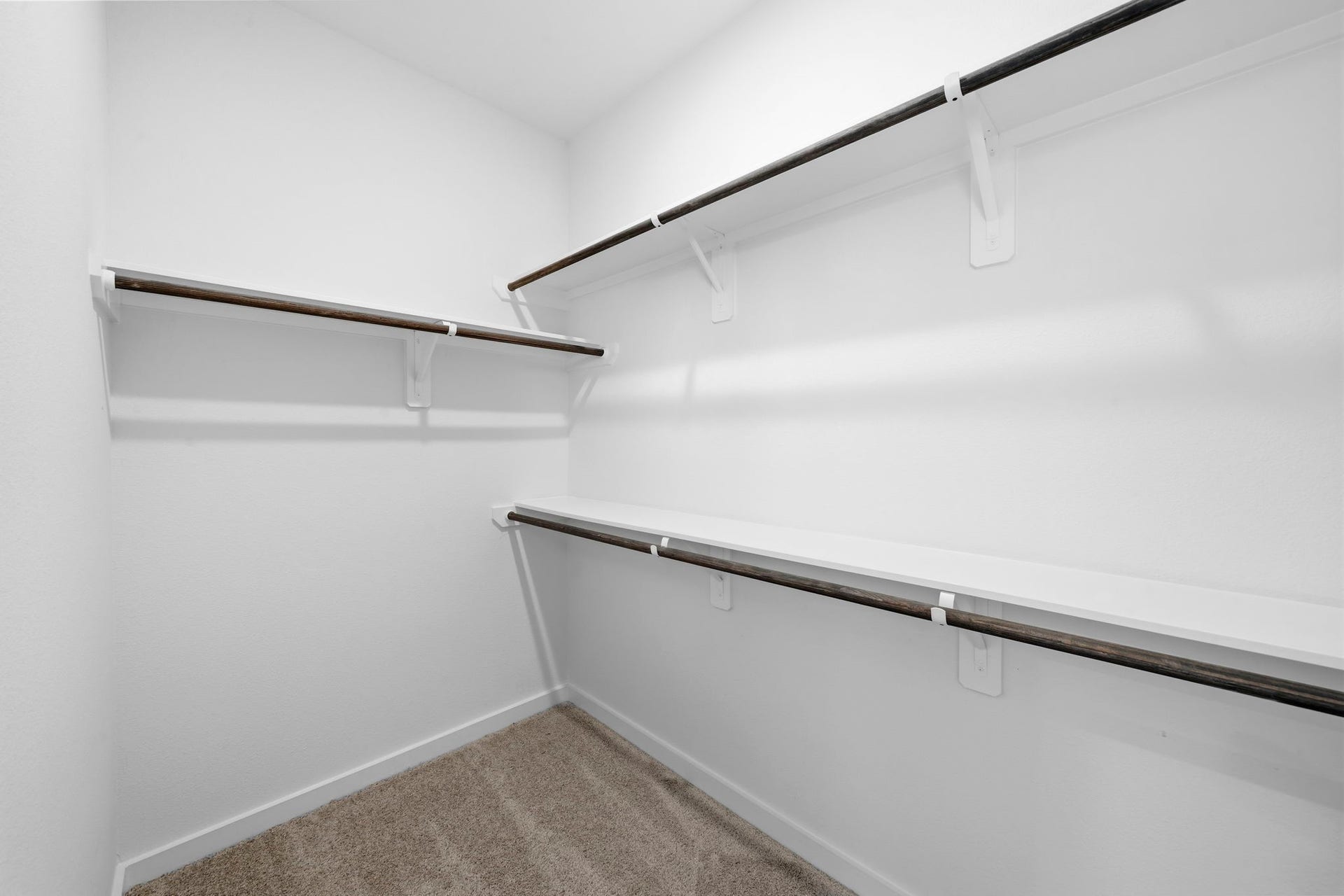 3317 City Heart Avenue, Richmond, TX 77406 The primary suite continues with a spacious walk-in closet, offering plenty of room to organize your wardrobe with ample hanging space and built-in shelving.