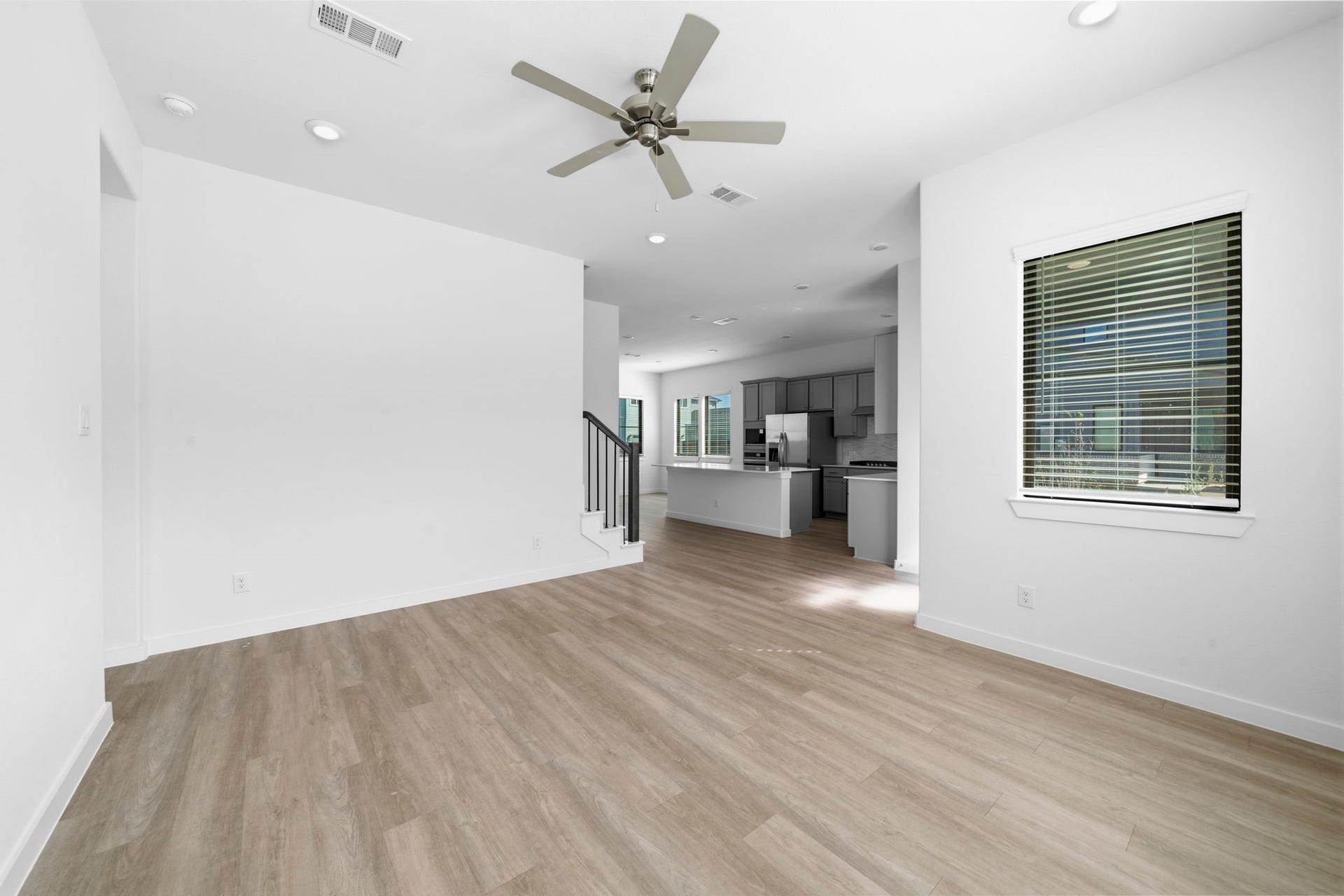 3317 City Heart Avenue, Richmond, TX 77406 Just steps from the main entry, the living room welcomes you with an open, airy layout and plenty of space to settle in. With warm wood look flooring, recessed lighting, and a bright blank canvas, you can easily create a space that feels uniquely yours for cozy nights and memorable gatherings.