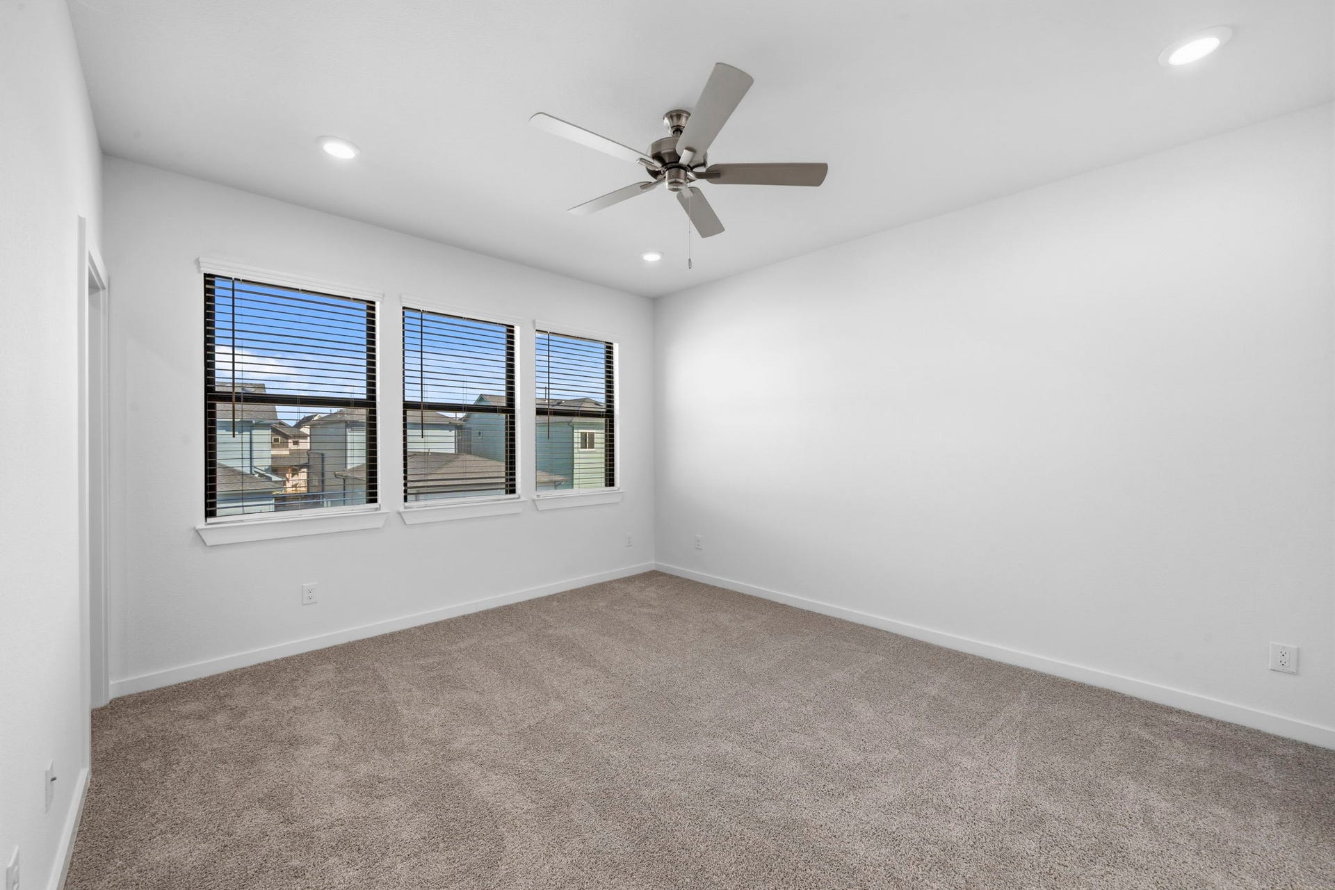 3317 City Heart Avenue, Richmond, TX 77406 Enjoy a peaceful retreat in the primary suite, where three large windows overlook the back of the home, bringing in beautiful natural light while offering an added sense of privacy.