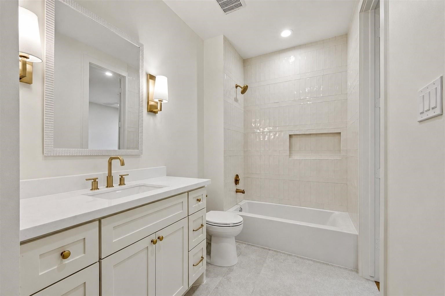 Guest Bathroom #2, with oversized marble vanity and linen closet