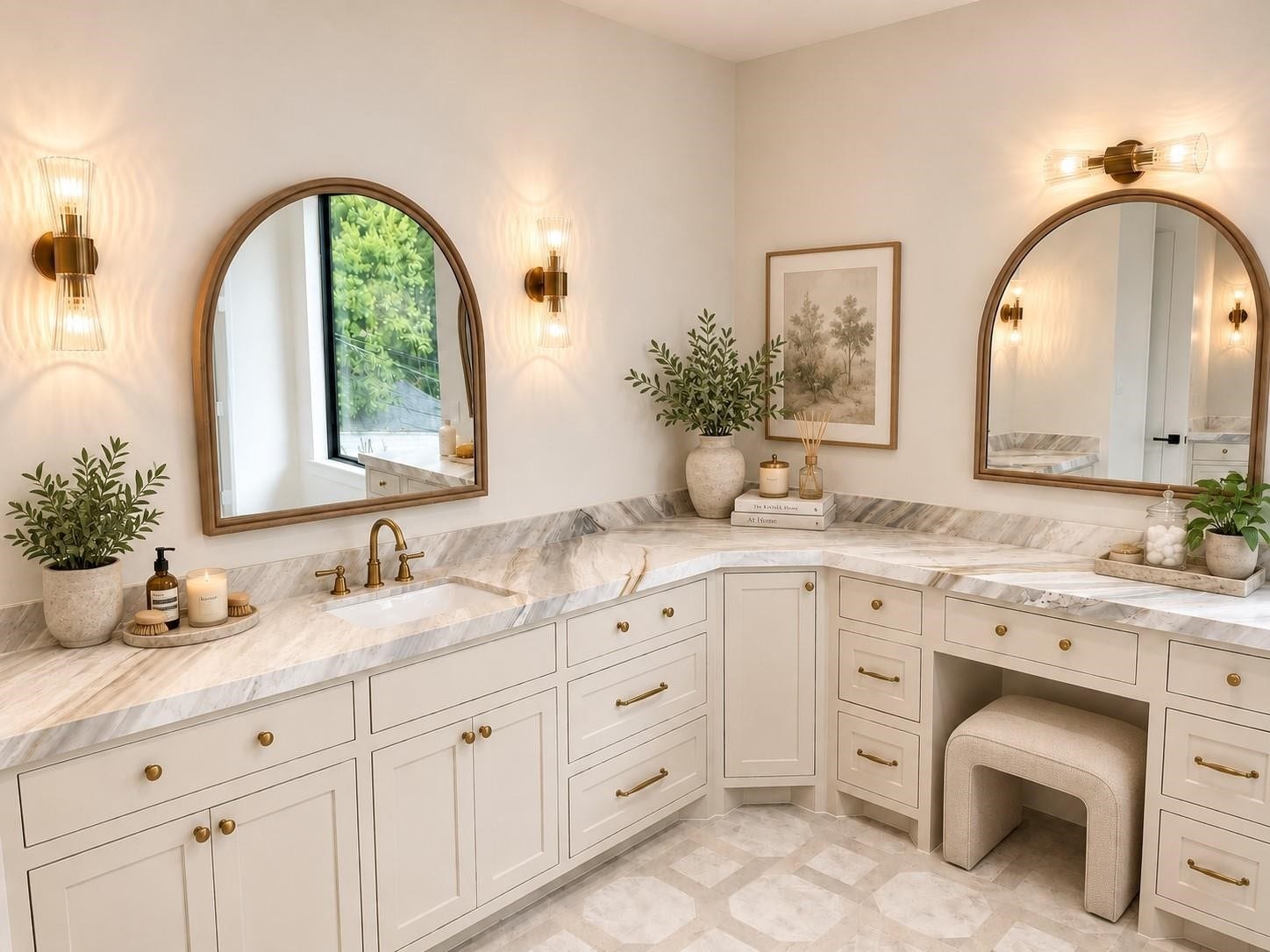 Her sink and vanity area with plenty of storage and marble countertops