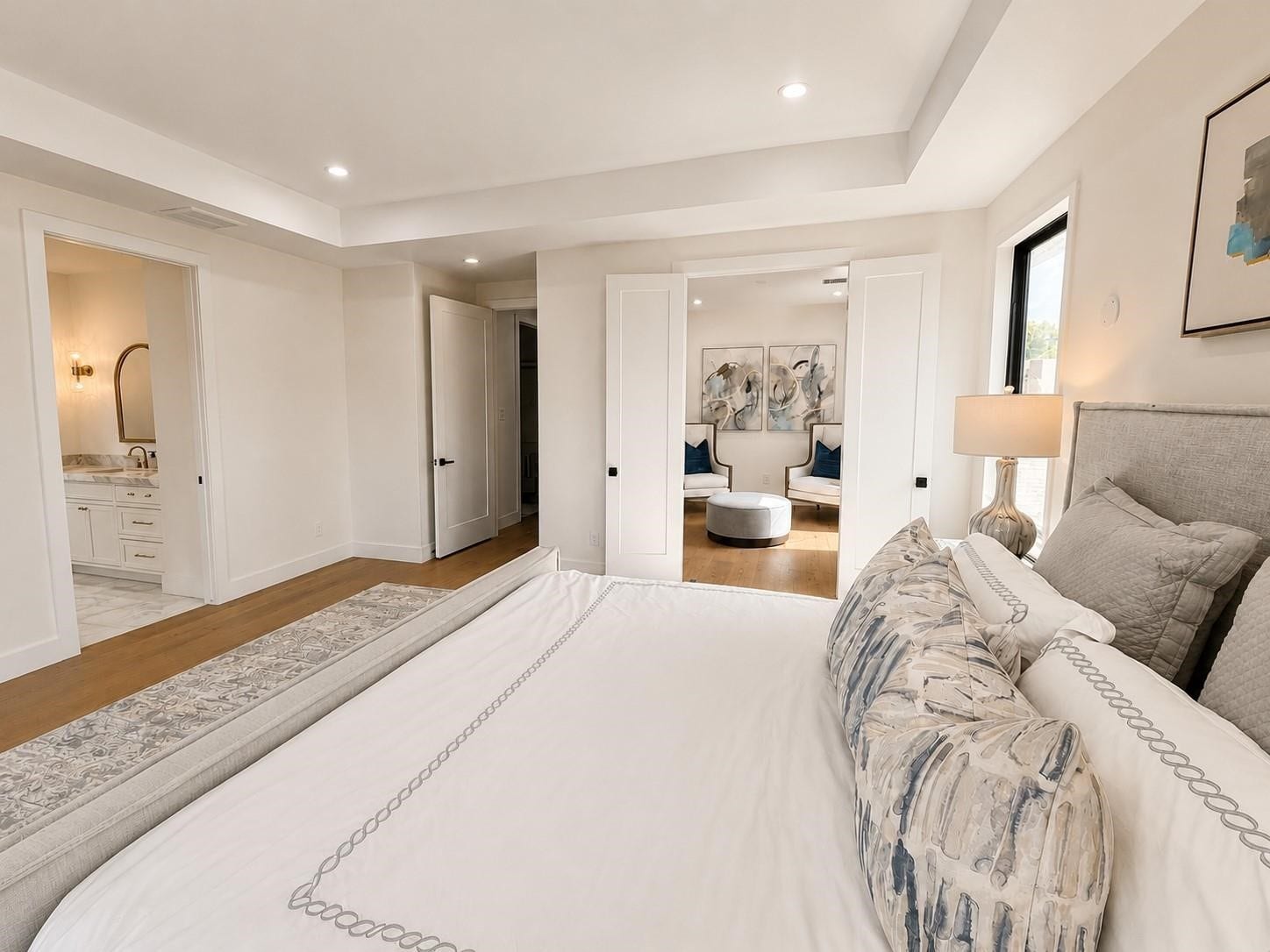 Oversized master bedroom with views into master sitting area
