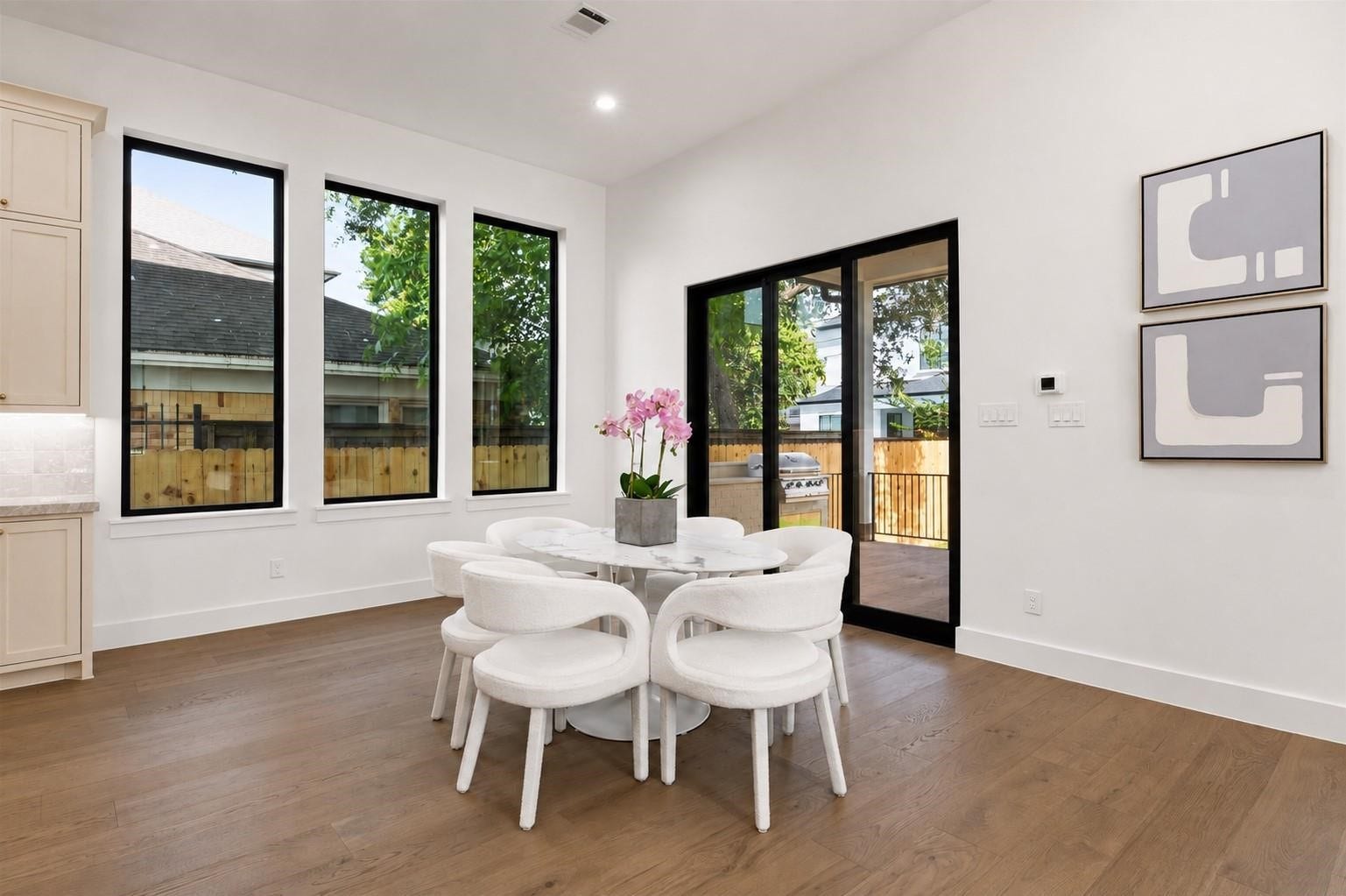 Oversized breakfast room with views to the oversized yard and outdoor kitchen. Paneled Sliding glass doors allow for indoor outdoor living