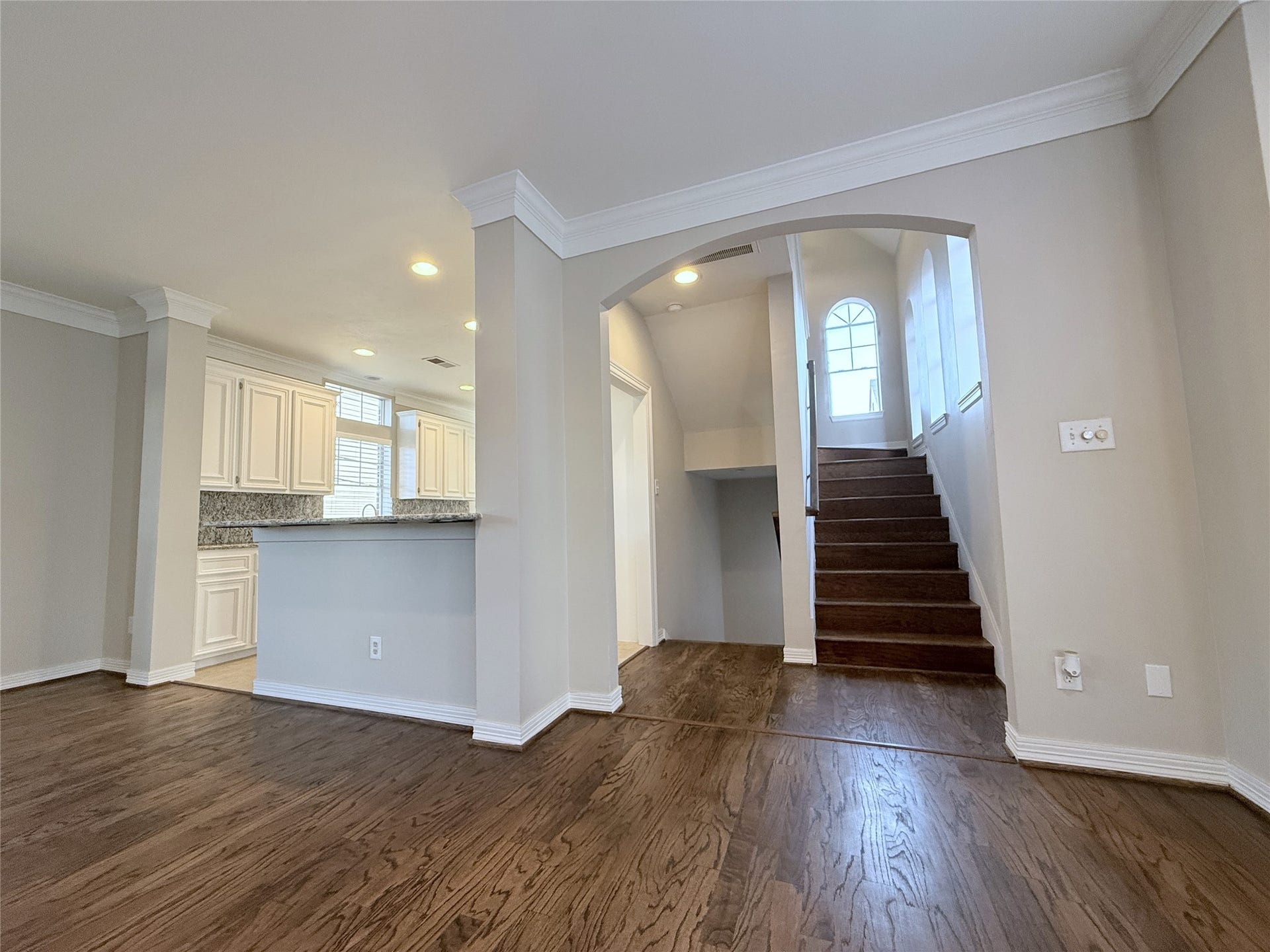 1963 Peden Street, Houston, TX 77019 At the top of the stair, on the second floor, an arched entry opens to the spacious living dining space.