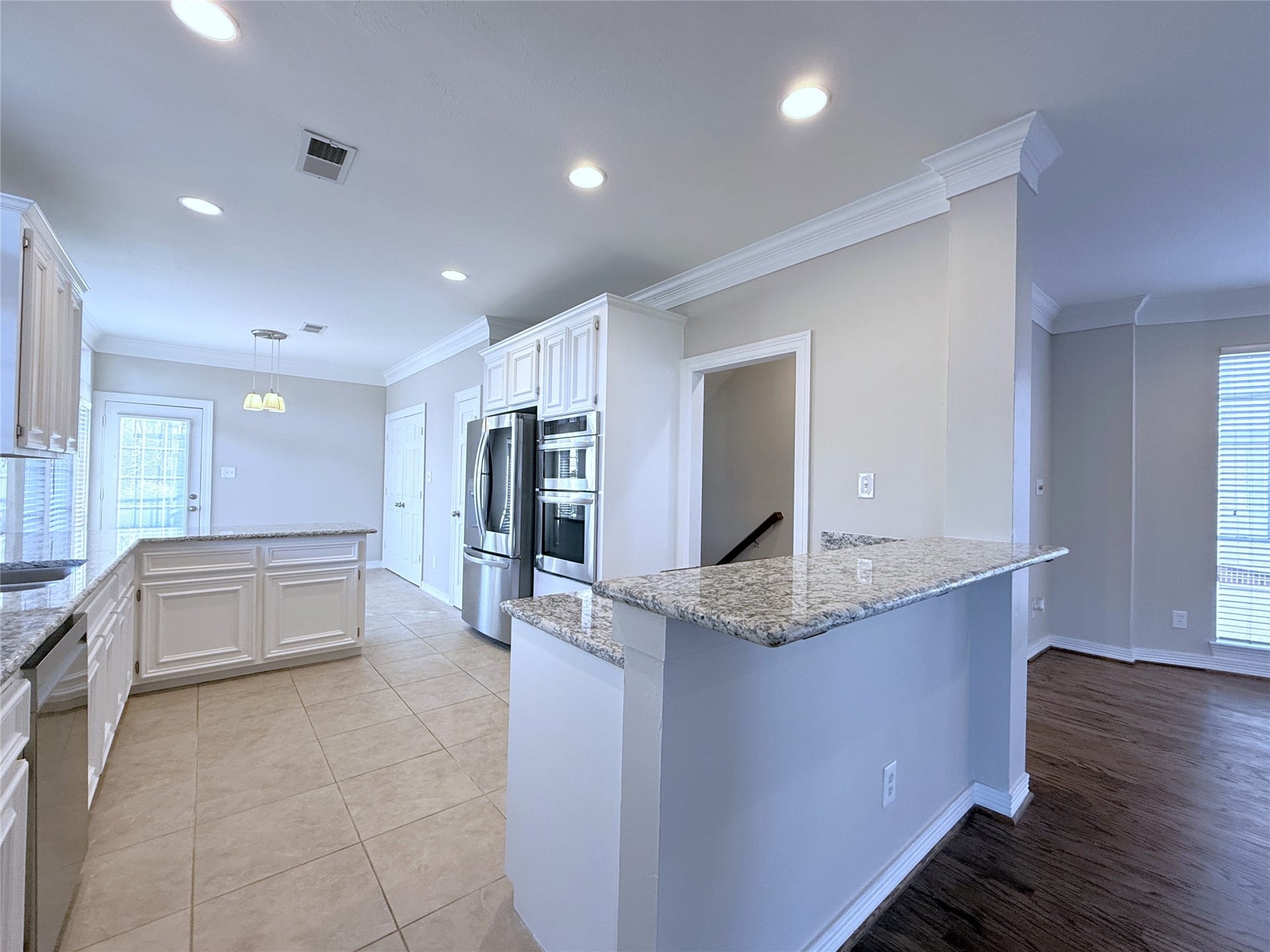 1963 Peden Street, Houston, TX 77019 From the kitchen, the breakfast bar is open to the living/dining space. Perfect for entertaining!