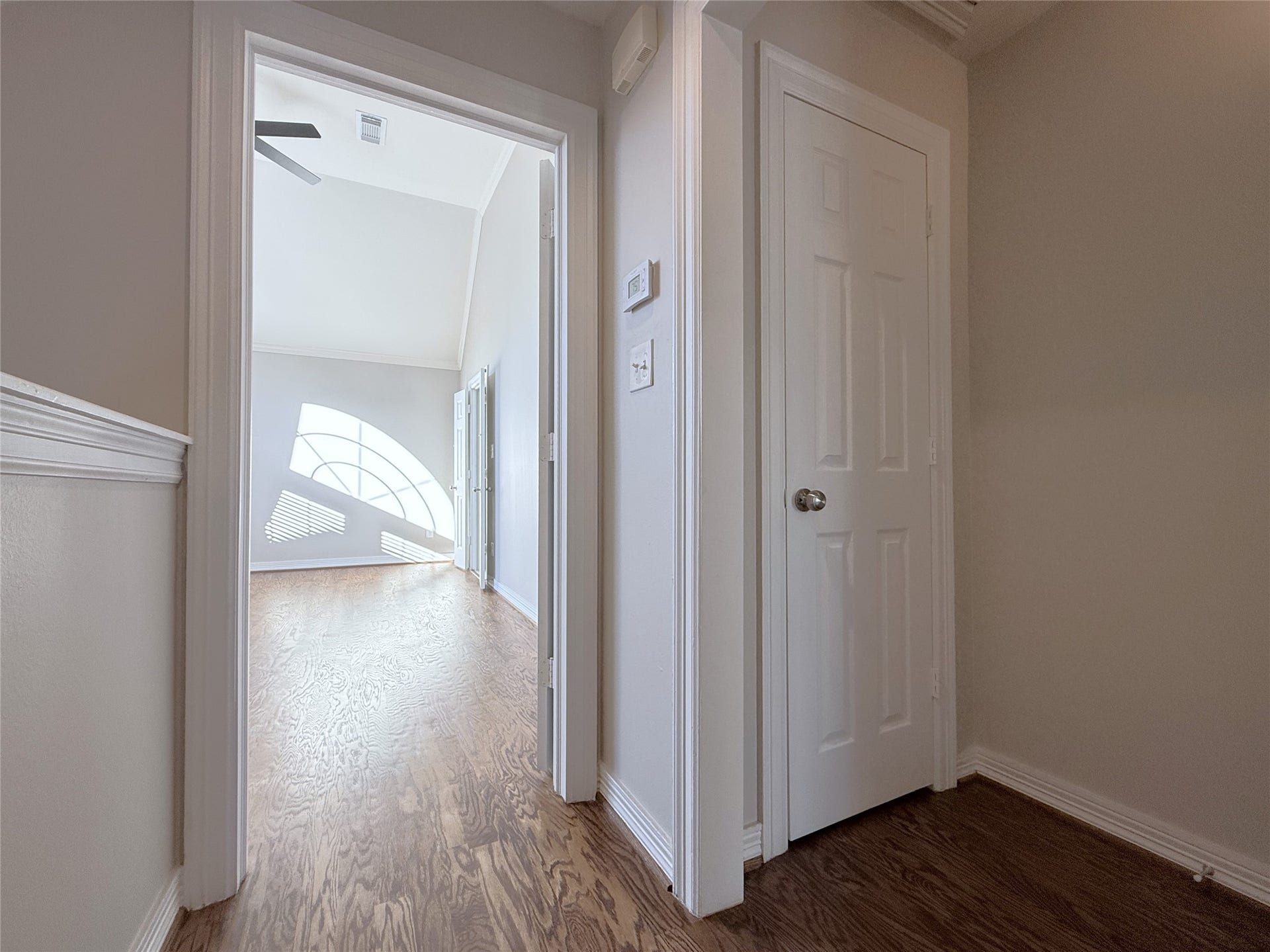 1963 Peden Street, Houston, TX 77019 In the hallway just outside the secondary bedroom is a closet. Beyond the open door is the primary suite.