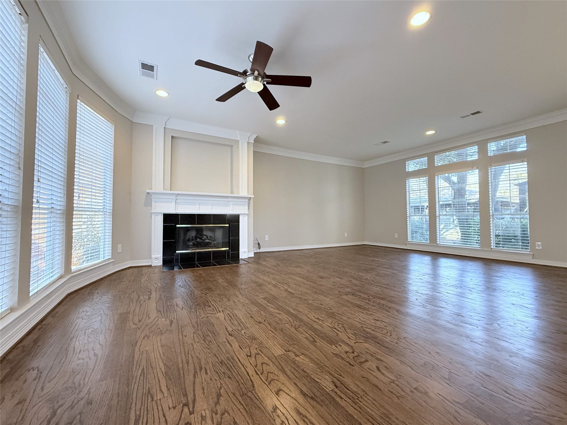 1963 Peden Street, Houston, TX 77019 Beautiful hardwood flooring, ceiling fan & gas log fireplace. Natural light flows in from tall windows in the the living & dining spaces.
