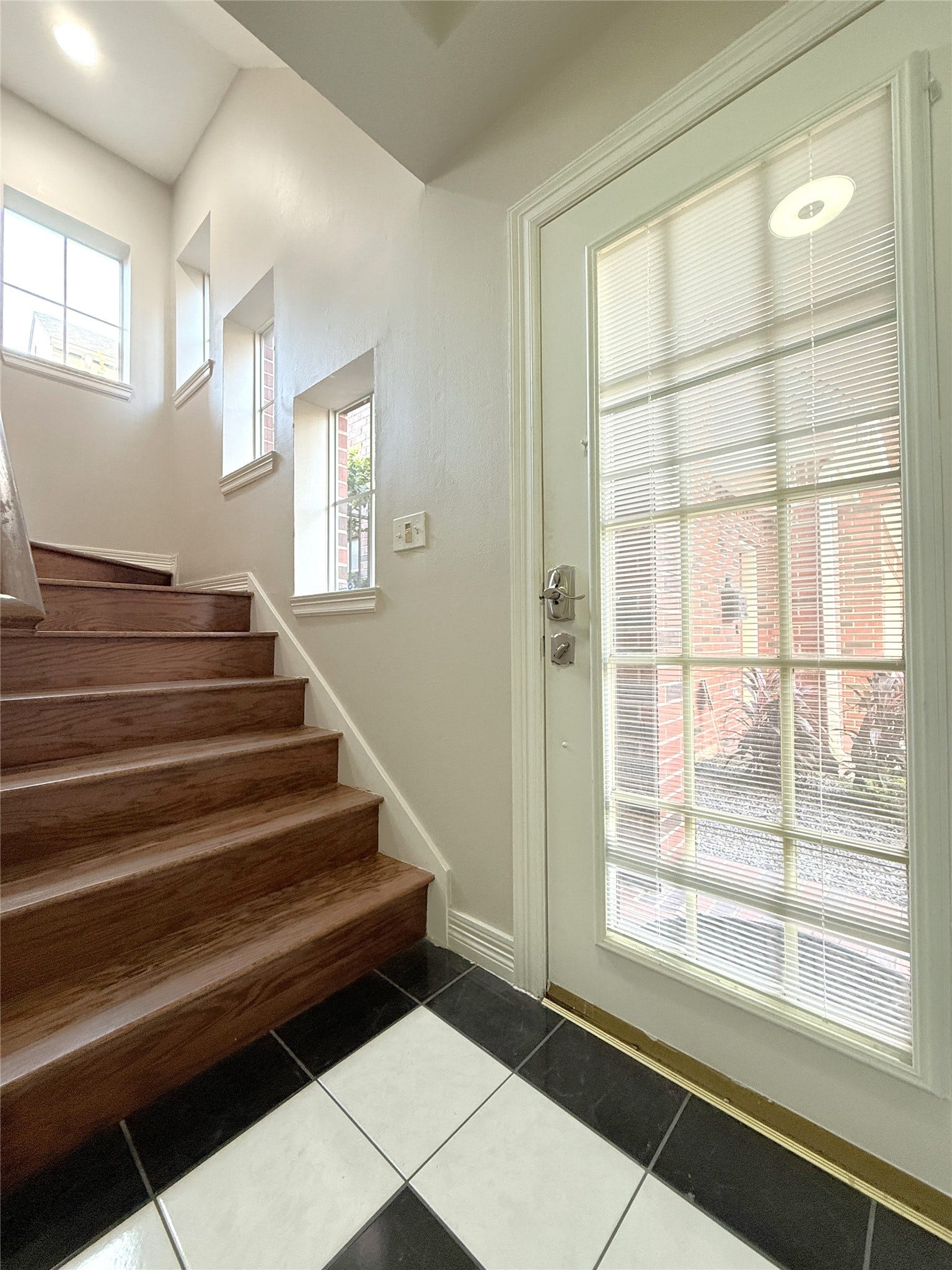1963 Peden Street, Houston, TX 77019 In the stairway to the 2nd floor, natural light flows in from the four windows.