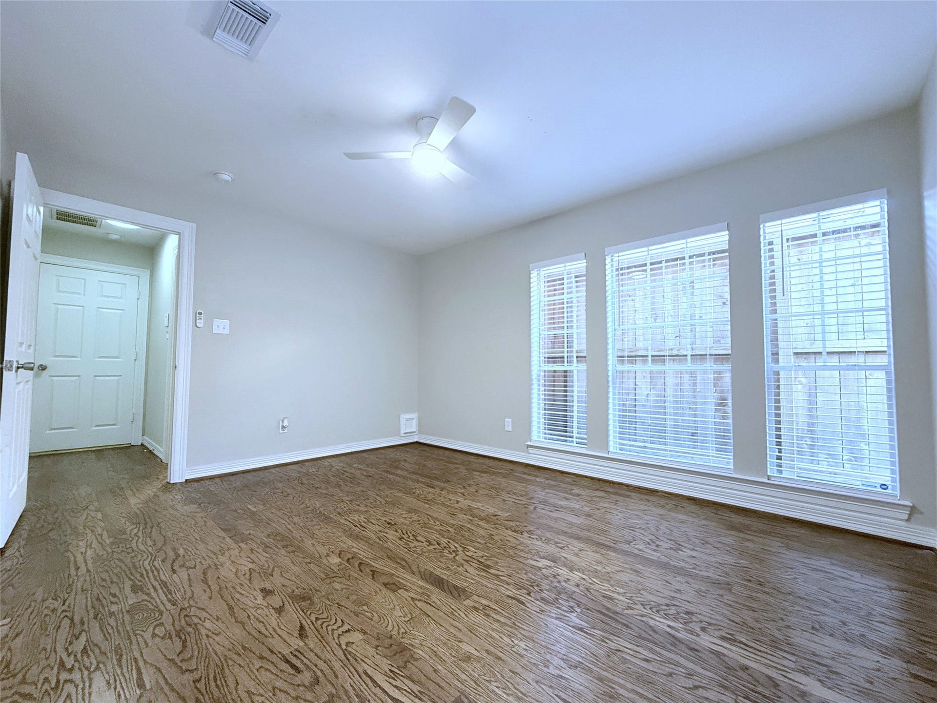 1963 Peden Street, Houston, TX 77019 Alternate view of the 1st floor bedroom. Beyond the door in the hallway is the garage.