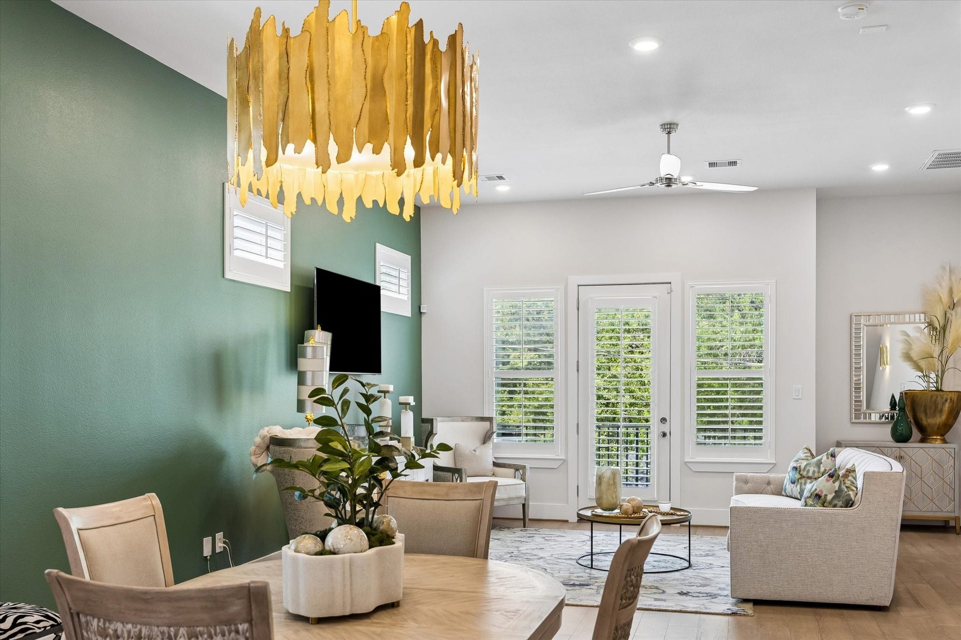 1226 W 21st Street, Houston, TX 77008 Designer details shine from the dramatic chandelier and rich accent wall to the wood shutters and open flow that makes entertaining feel easy.