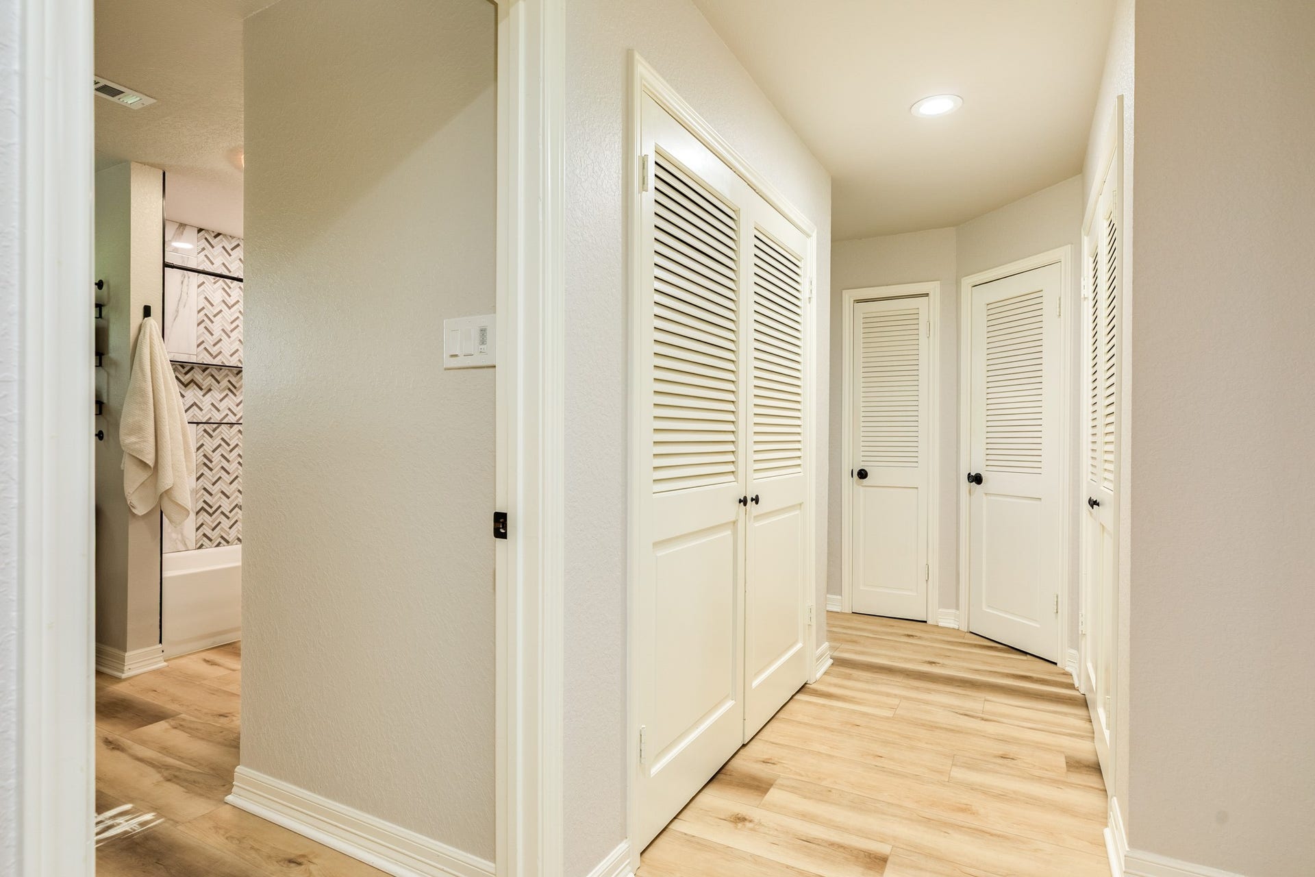 4418 Georgia Street, Santa Fe, TX 77517 Hallway leading to the secondary bedrooms, highlighting the homes split floor plan and abundant storage