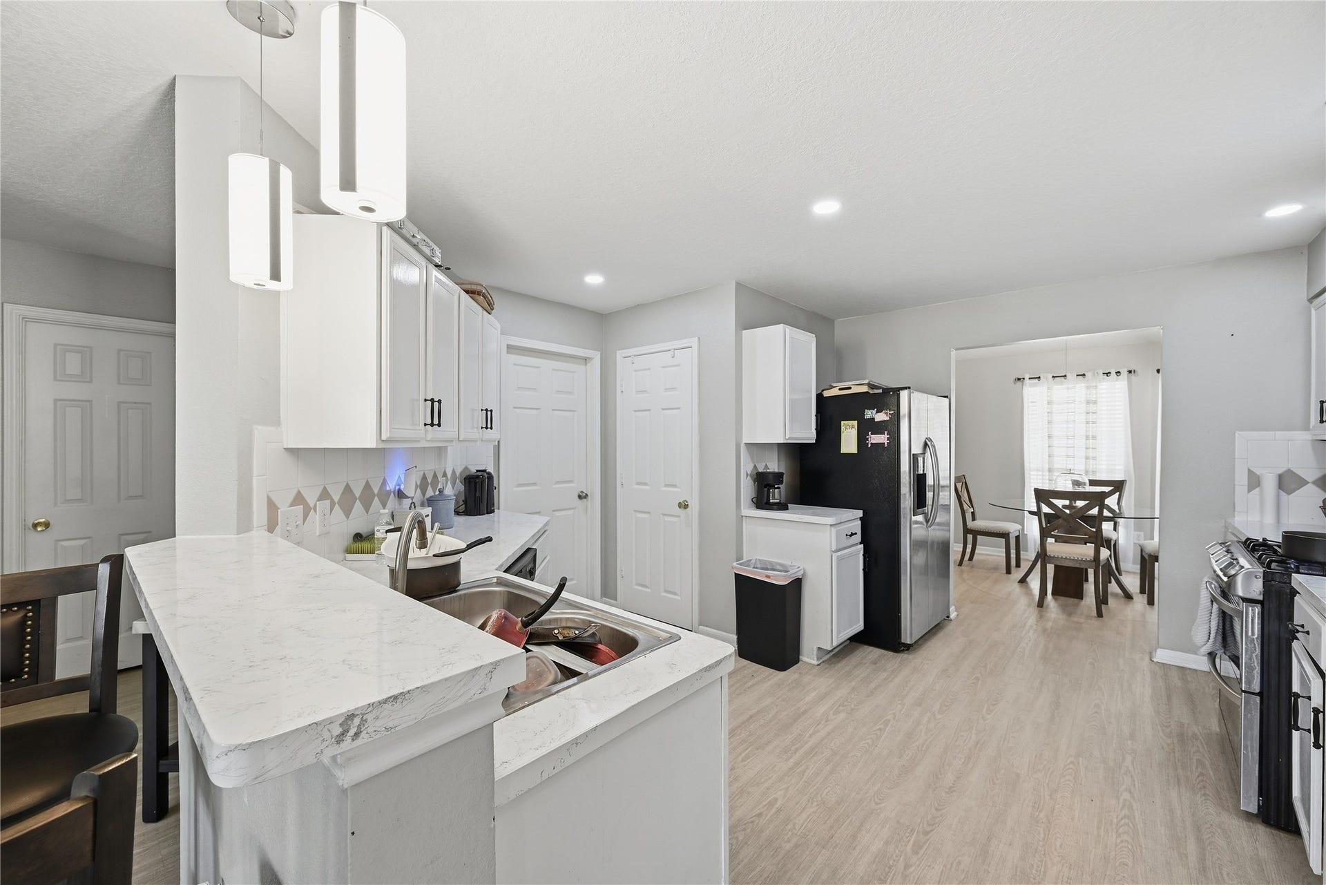 18215 Echo Mar Lane, Houston, TX 77084 Kitchen has neutral colors and recessed lighting.