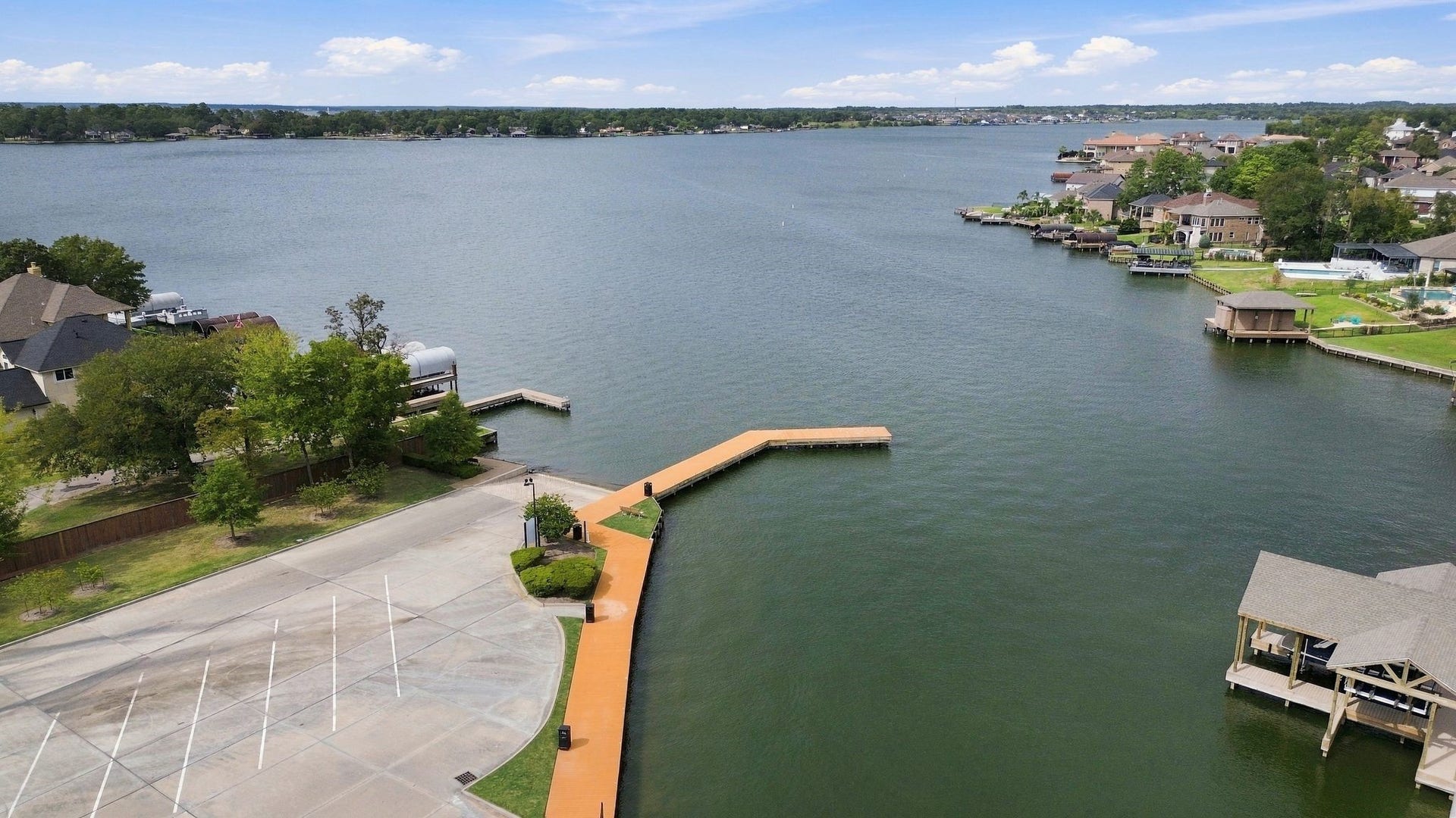 11371 Dawn Beach Lane, Conroe, TX 77304 Enjoy stunning lakefront views with convenient access to a private dock, perfect for water enthusiasts and serene living.