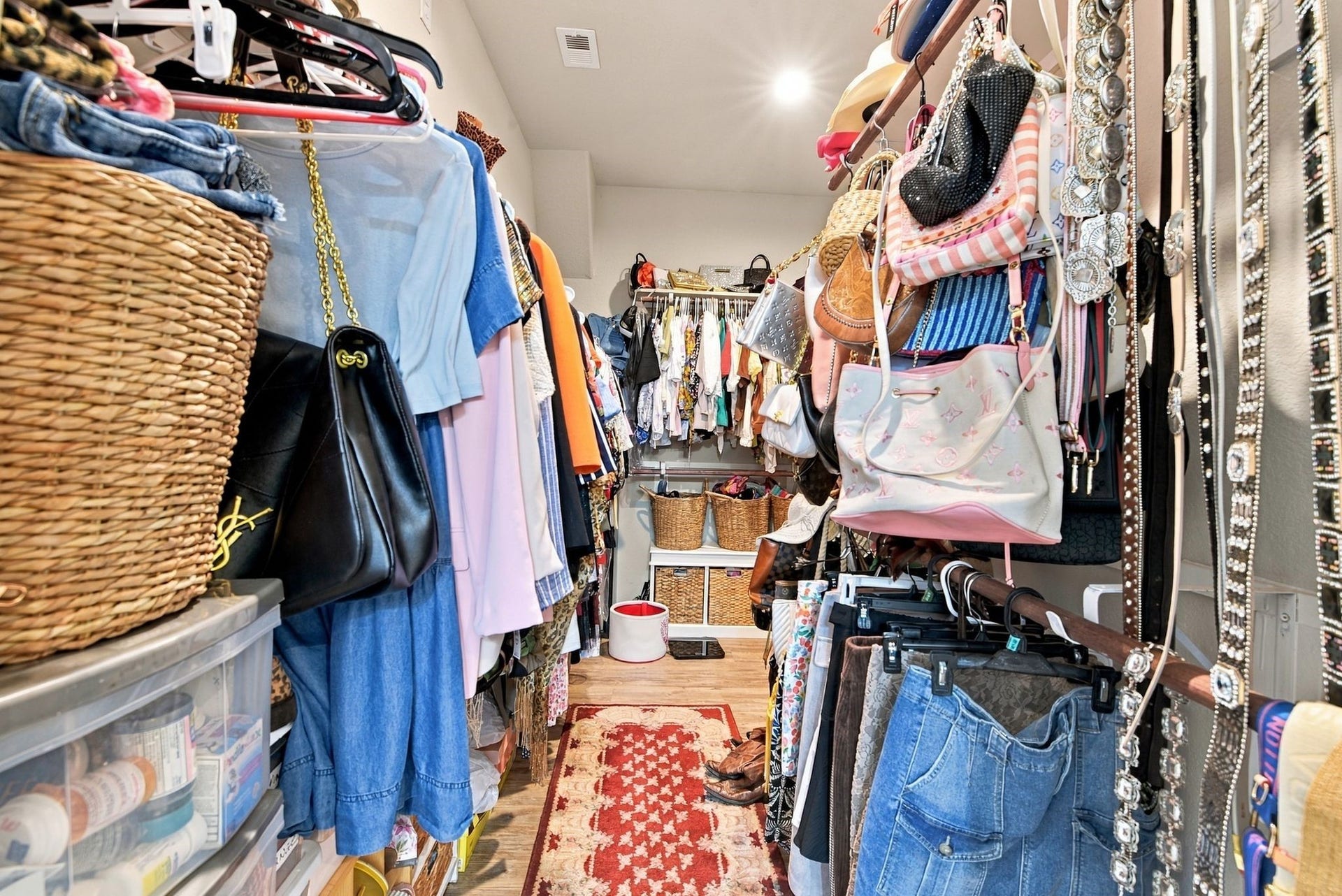 11371 Dawn Beach Lane, Conroe, TX 77304 Spacious walk-in closet with ample hanging space, shelving for accessories, and organized storage solutions, perfect for fashion enthusiasts.