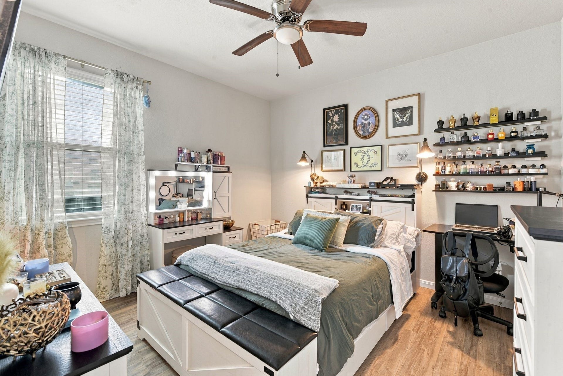 11371 Dawn Beach Lane, Conroe, TX 77304 Charming bedroom with ample natural light, featuring a cozy bed, stylish wall art, and a functional workspace.