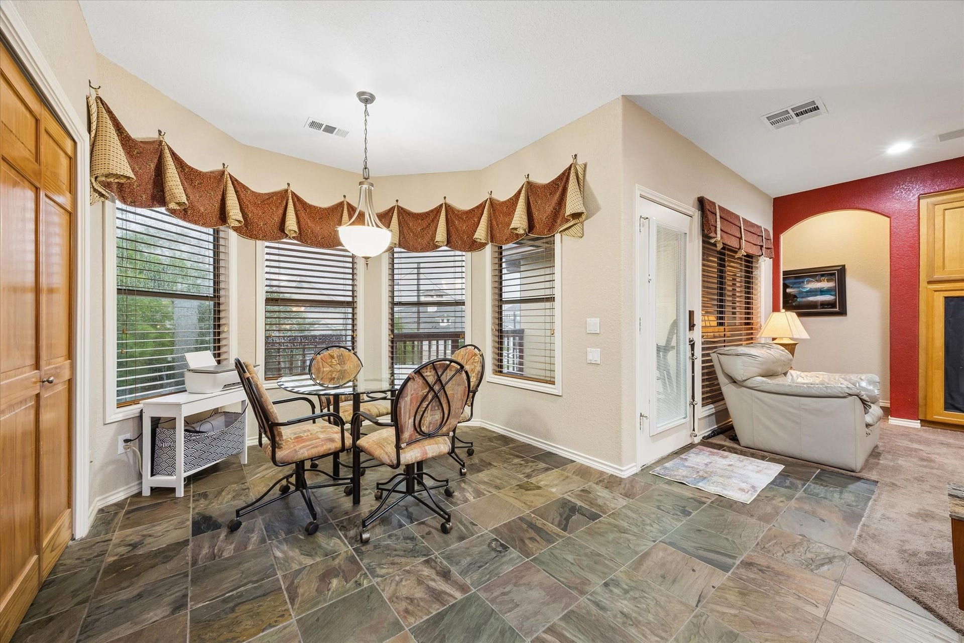 3040 Bayshore Drive, Bacliff, TX 77518 Breakfast area with bay windows and abundant of natural light, offering views of the backyard and access to the upper deck. Located off the kitchen and main living space.
