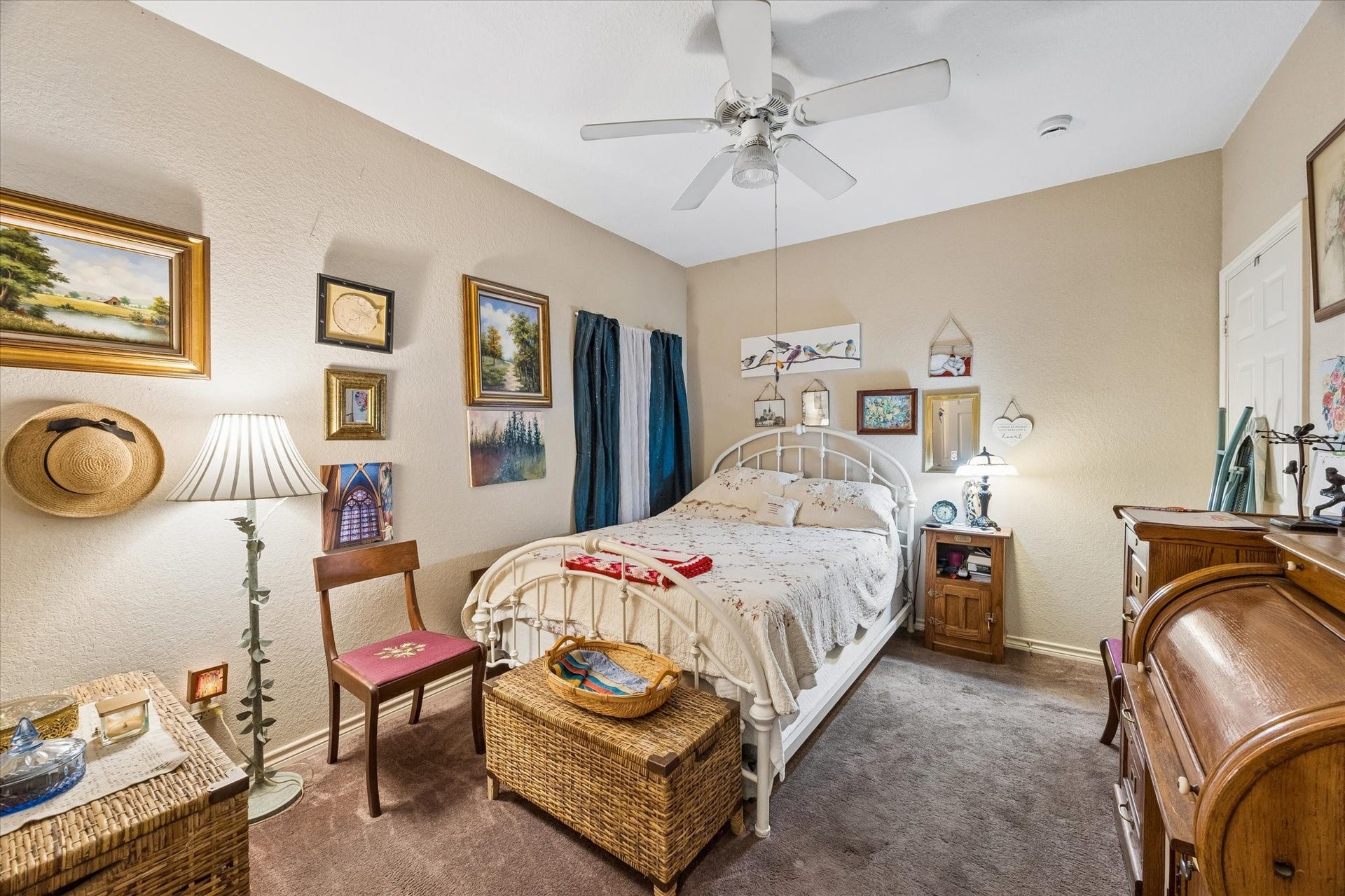 3040 Bayshore Drive, Bacliff, TX 77518 Private bedroom within the garage apartment featuring ceiling fan, natural light, and comfortable layout. Ideal for guests or rental space with separation from the main residence.