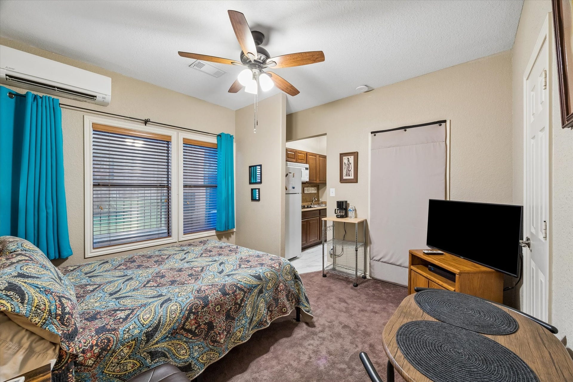 3040 Bayshore Drive, Bacliff, TX 77518 Fourth bedroom configured as a private suite, featuring a kitchenette, en-suite bathroom, and separate exterior entry. Currently utilized as a short-term rental, offering strong flexibility for guest accommodations or income-producing use.