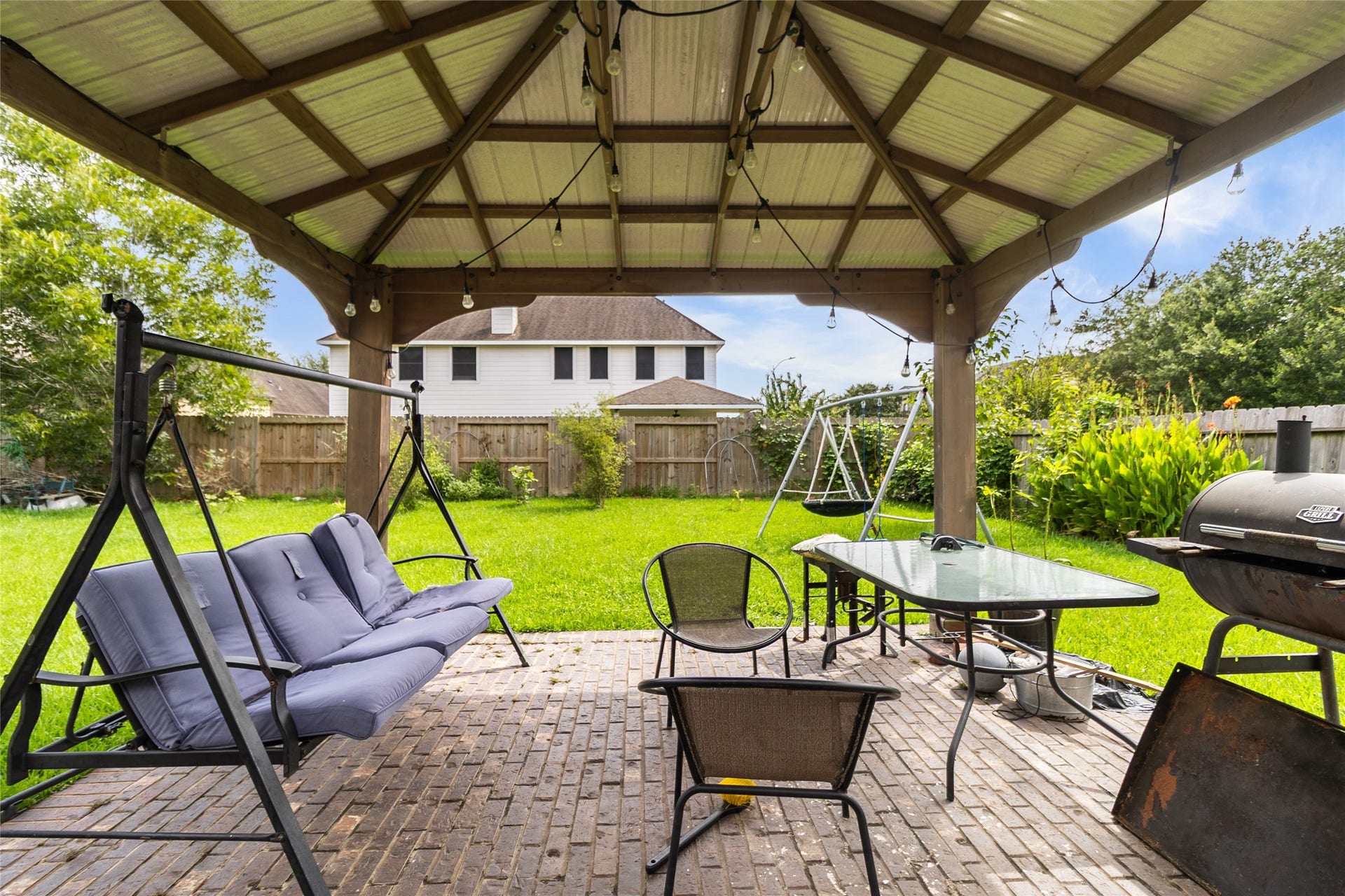 1231 Abigail Lane, Friendswood, TX 77546 Weekends are made for relaxing under your covered backyard pavilion, where outdoor dining, grilling, and quiet evenings come together in your spacious fenced yard.
