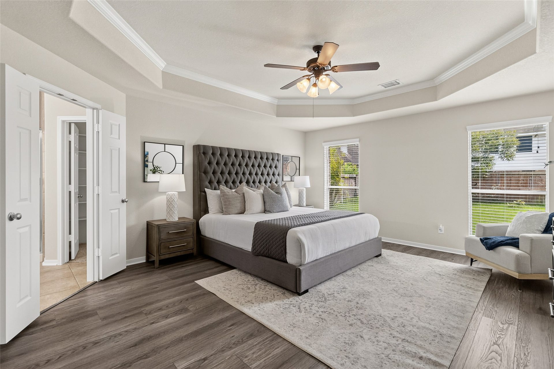 1231 Abigail Lane, Friendswood, TX 77546 Your spacious primary suite offers a peaceful retreat with a tray ceiling, generous layout, and plenty of room to relax at the end of the day.