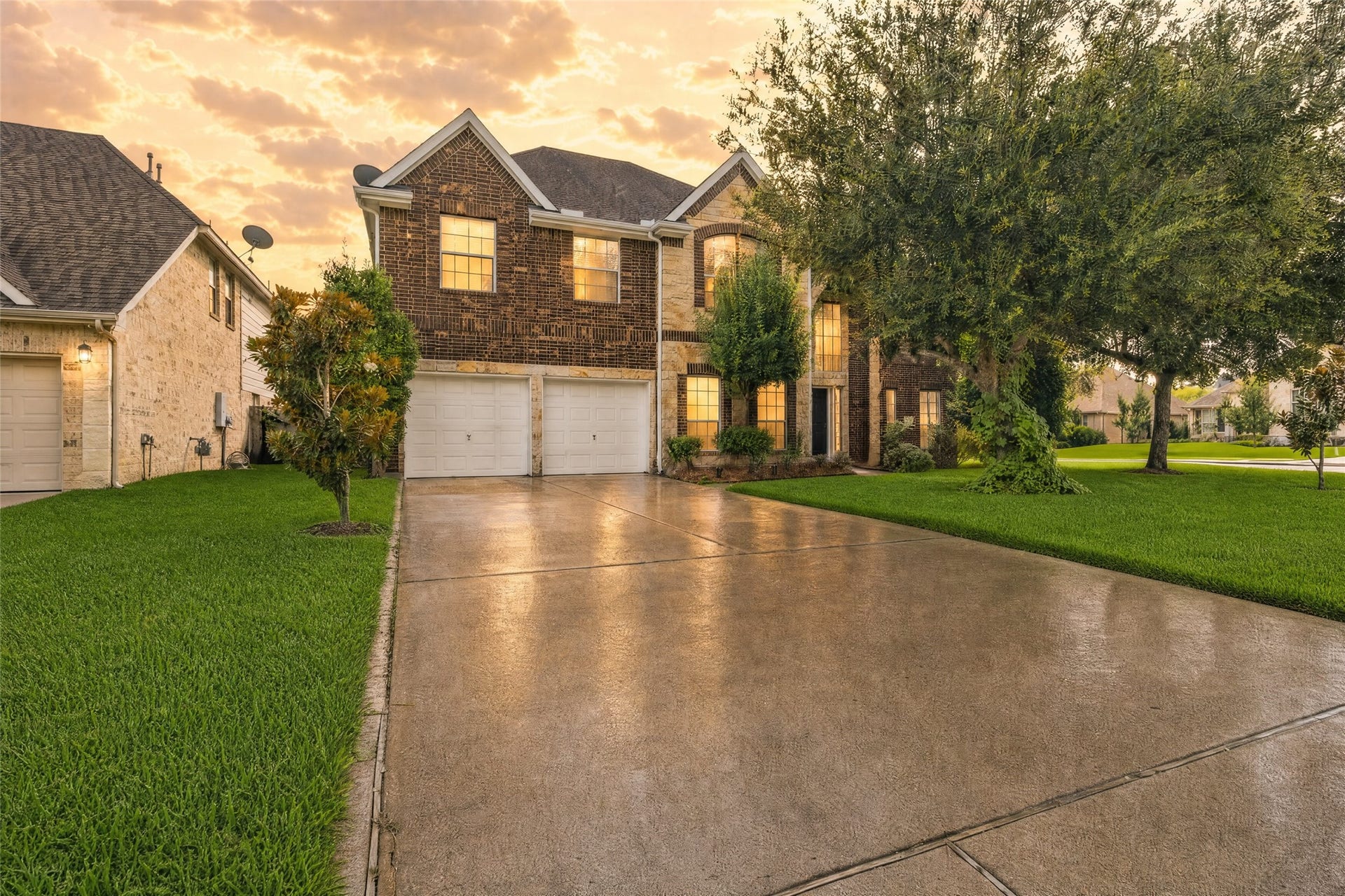 1231 Abigail Lane, Friendswood, TX 77546 Coming home feels inviting with mature shade trees, a wide driveway, and timeless brick-and-stone curb appeal.