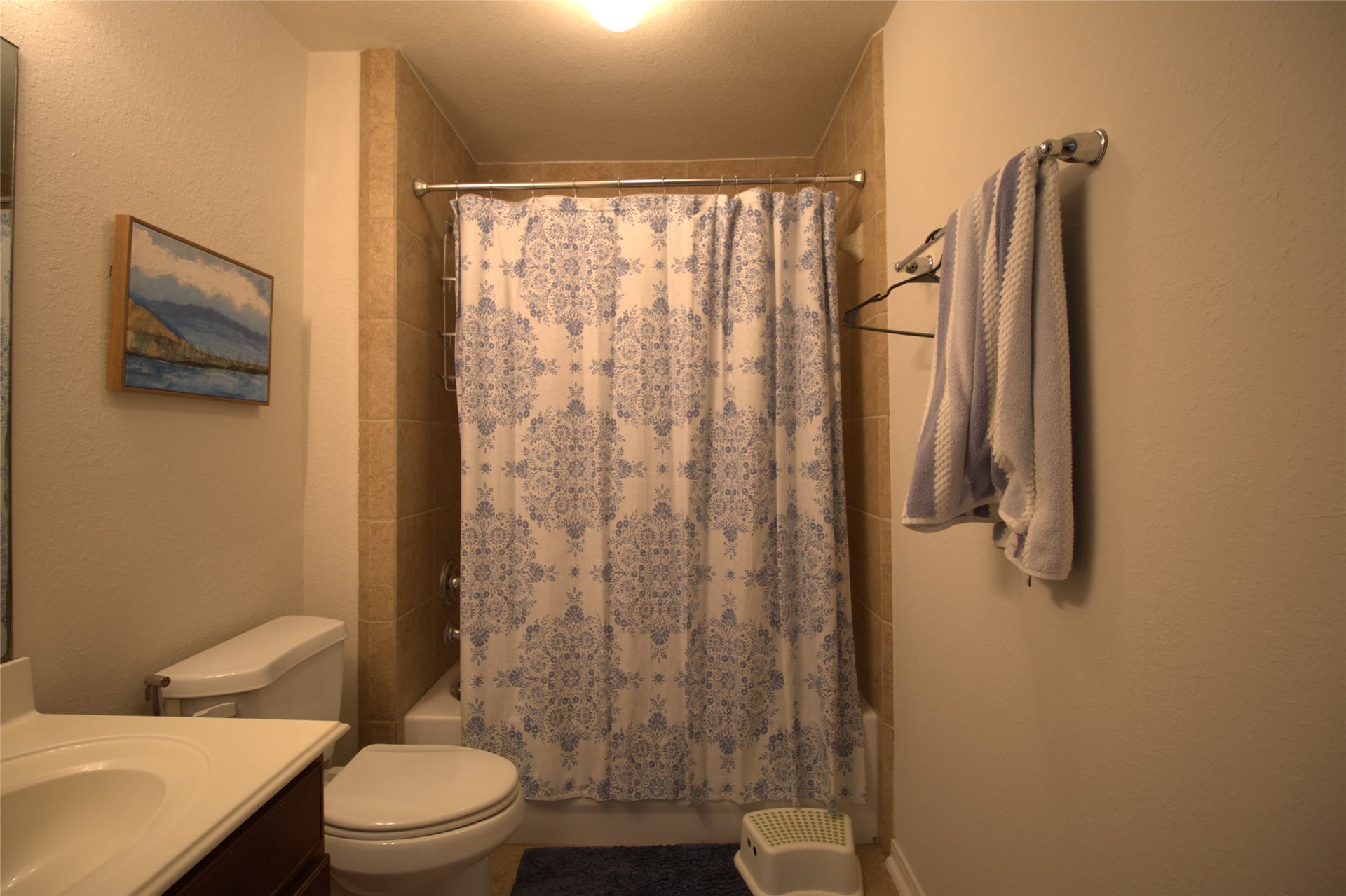 1231 Abigail Lane, Friendswood, TX 77546 Your full upstairs bath offers a convenient layout with a tiled tub and shower combination, making busy mornings and guest stays a breeze.