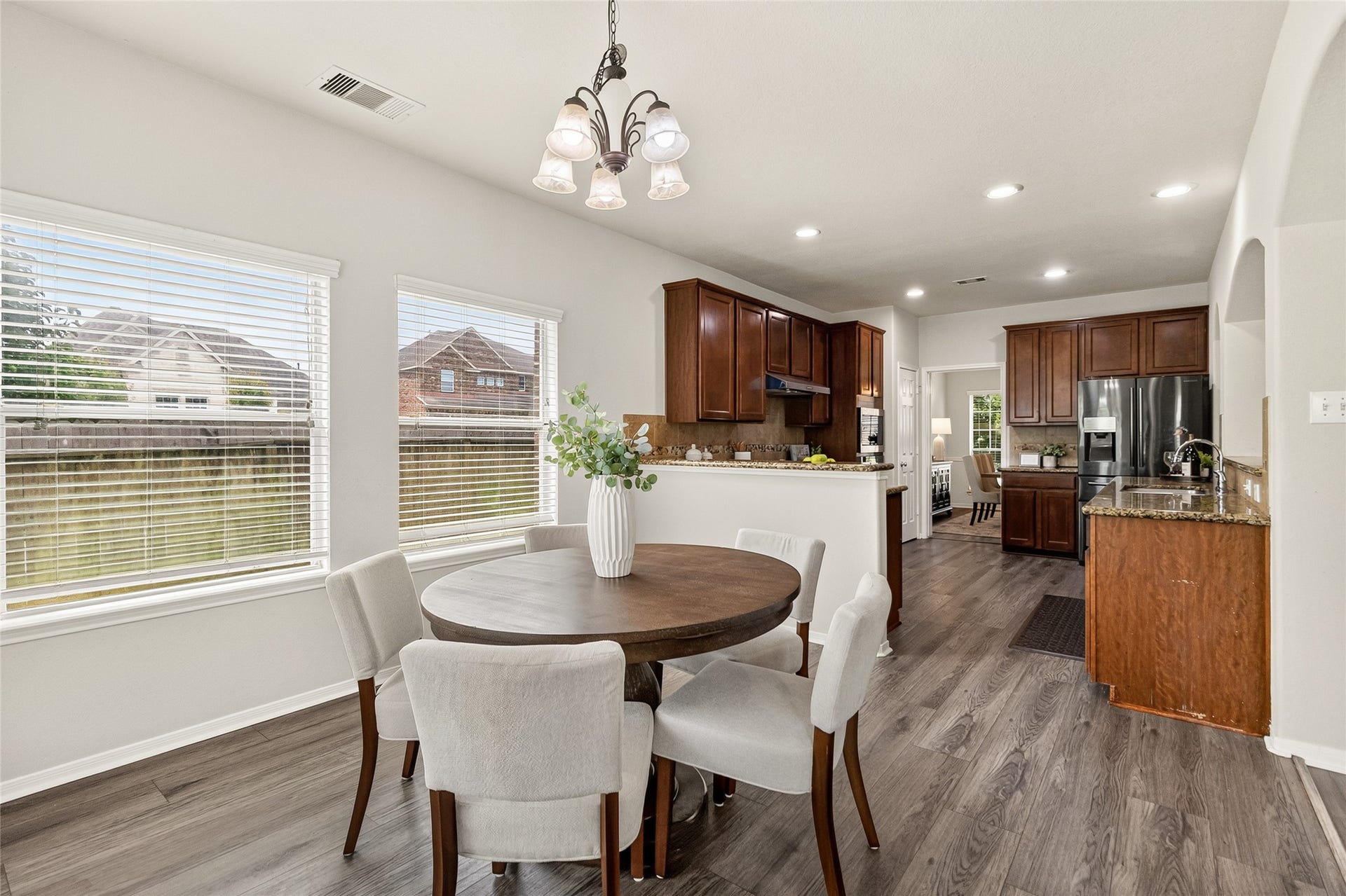 1231 Abigail Lane, Friendswood, TX 77546 Casual meals and morning coffee become part of your daily routine in the sunny breakfast area overlooking the backyard.