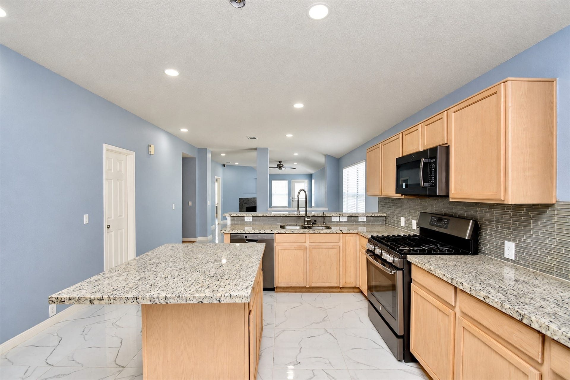 6003 Baldwin Elm Street, Richmond, TX 77407 Kitchen Area
***Property is vacant. Photo digitally enhanced with AI; lighting, color, and ceiling appearance adjusted. ***