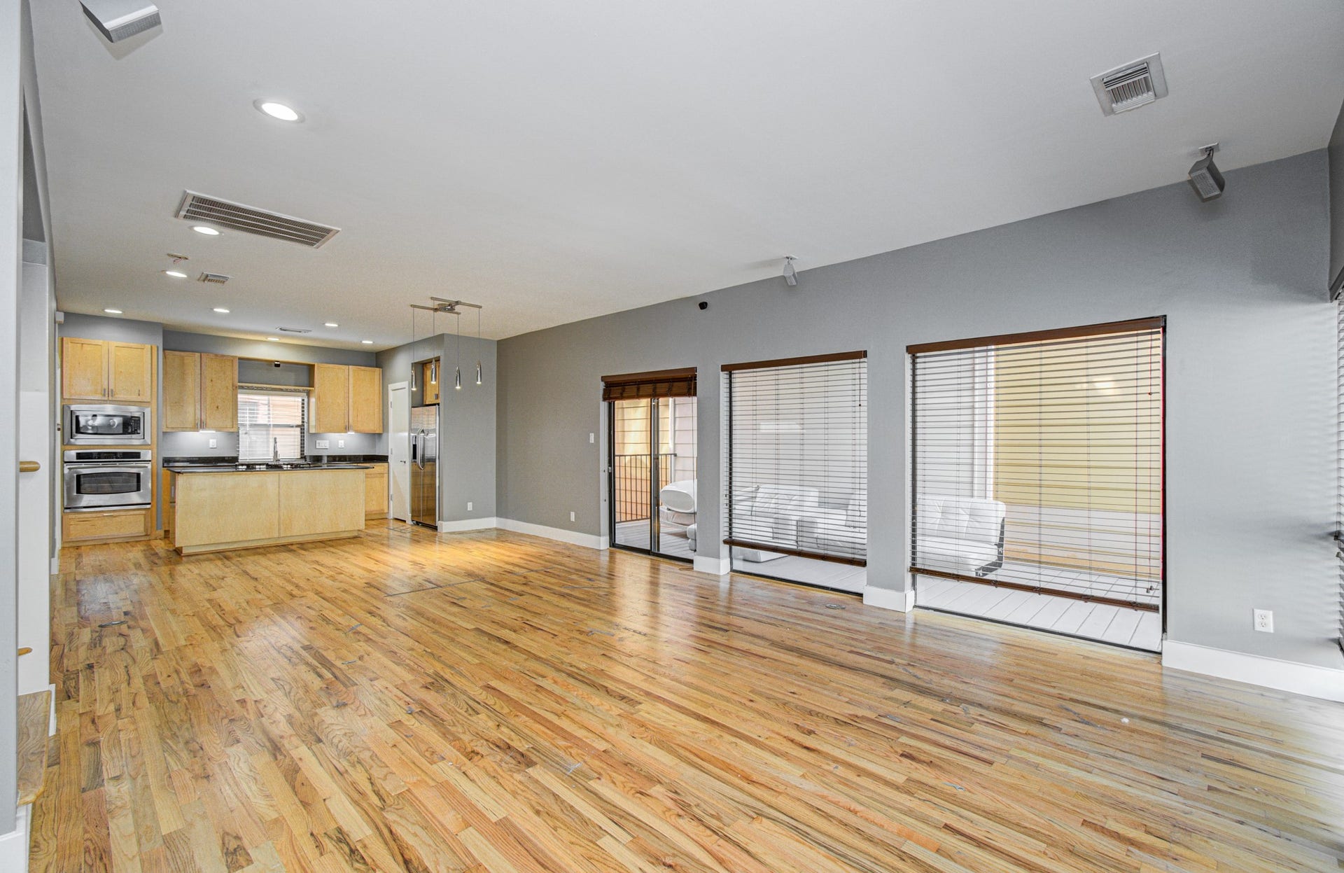 4410 Spencer Street, #A, Houston, TX 77007 Off the living is a large balcony to enjoy.