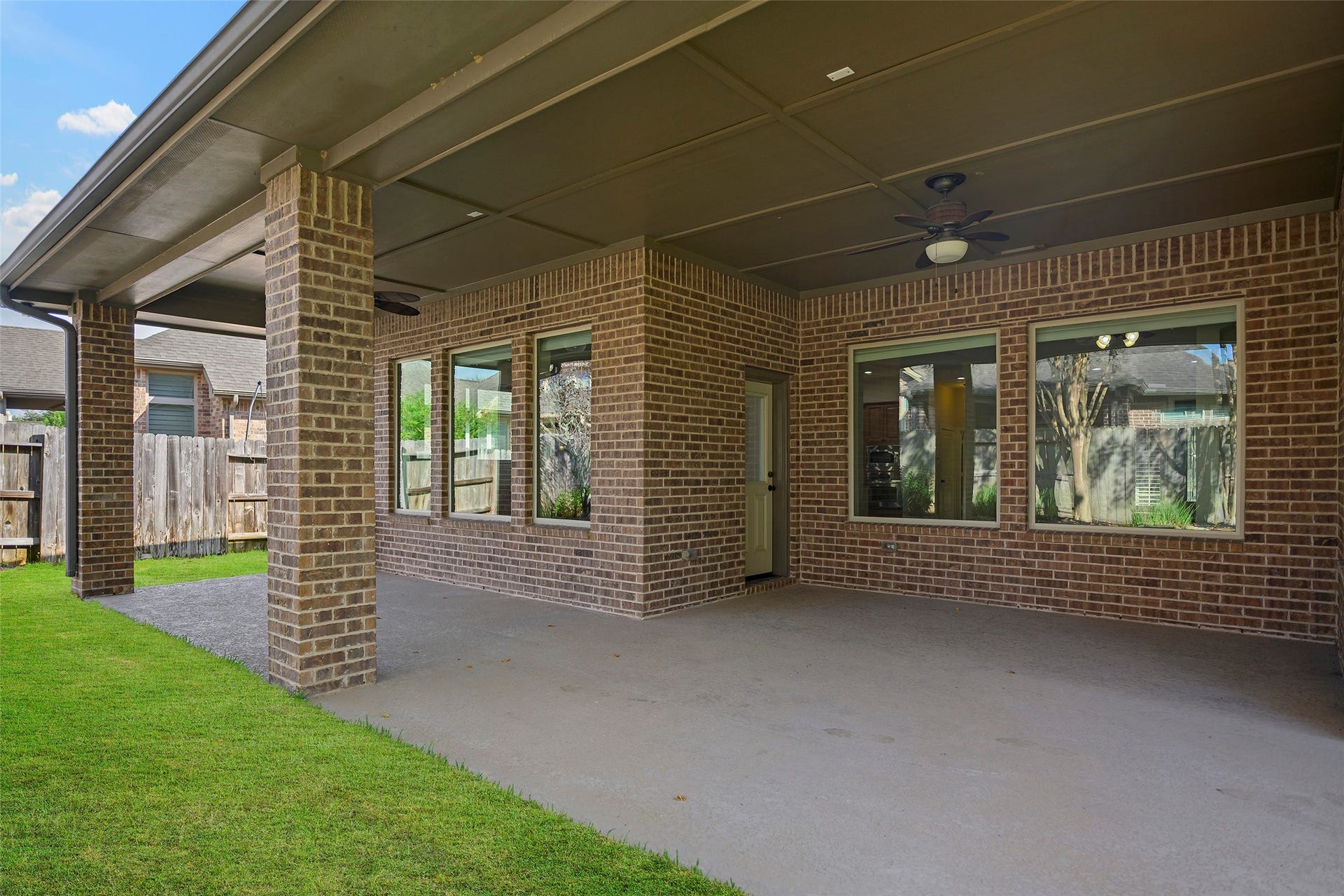 Amazing covered back patio perfect for hosting your next BBQ.
