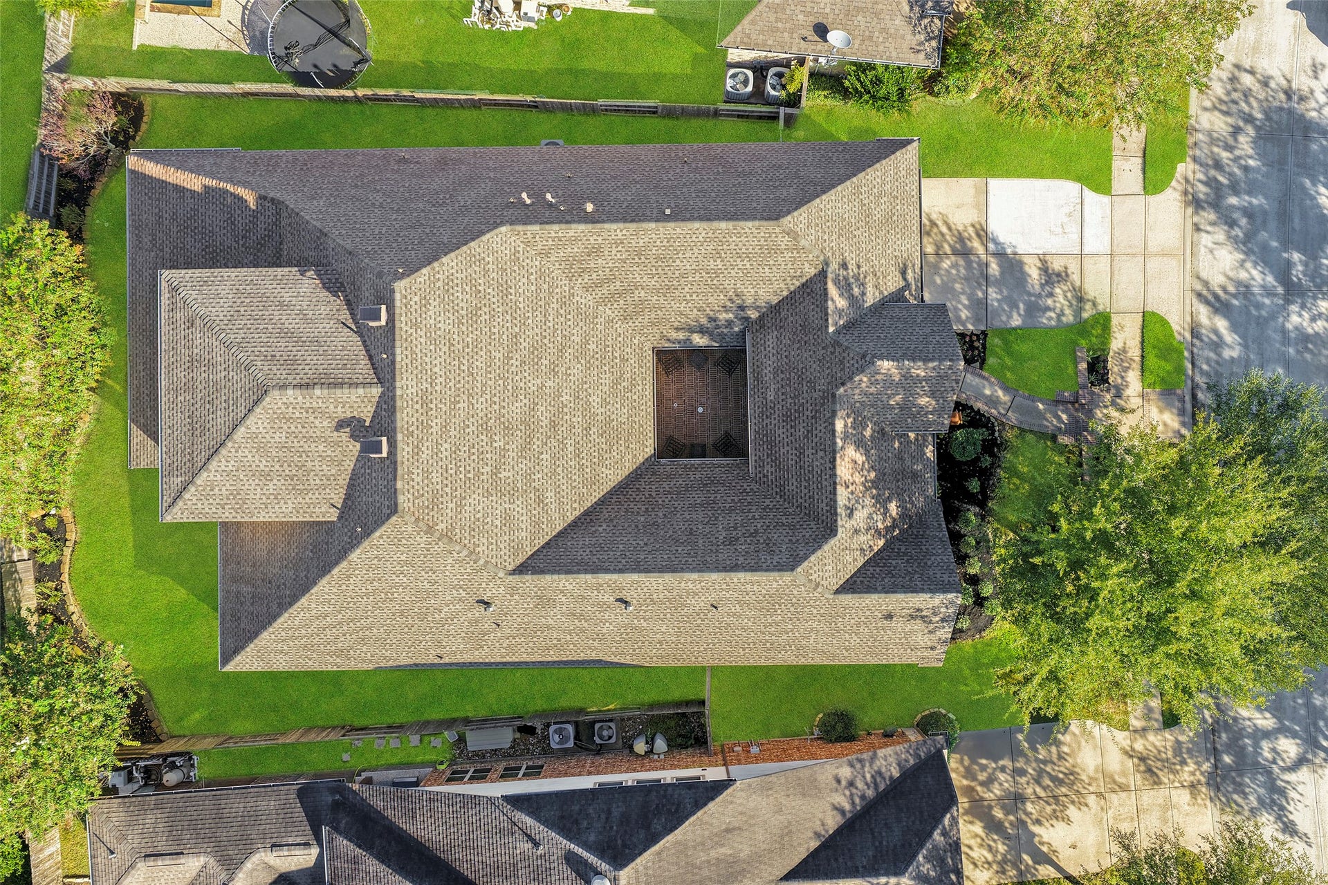 Areial view of the home with its new shingles in July 2026.