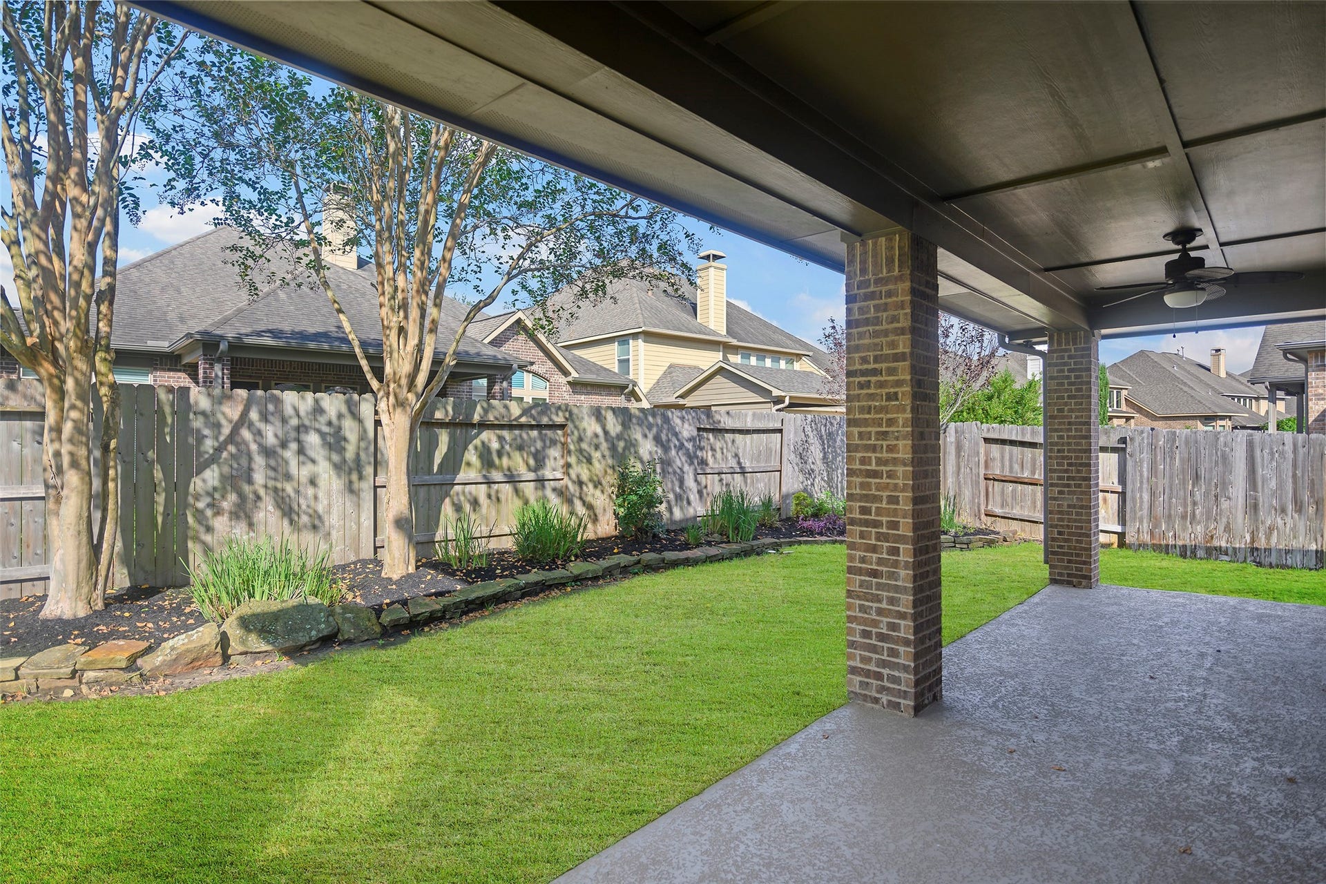 Beautifully landscaped yard with sprinkler system.