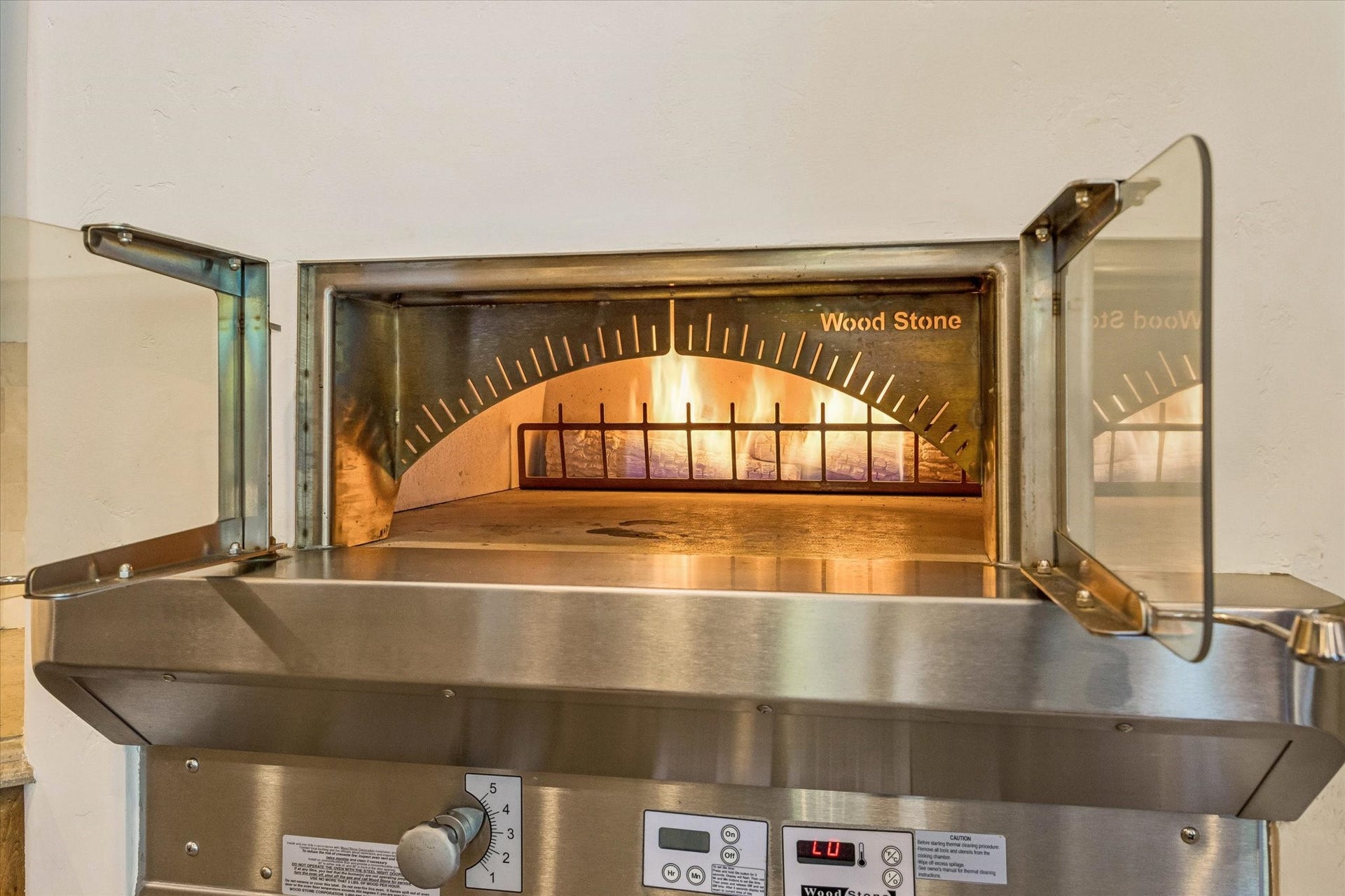 34 Liberty Bell Circle, Bunker Hill Village, TX 77024 A standout feature of the kitchen, the built-in pizza oven brings restaurant-quality cooking and entertaining right into the home.