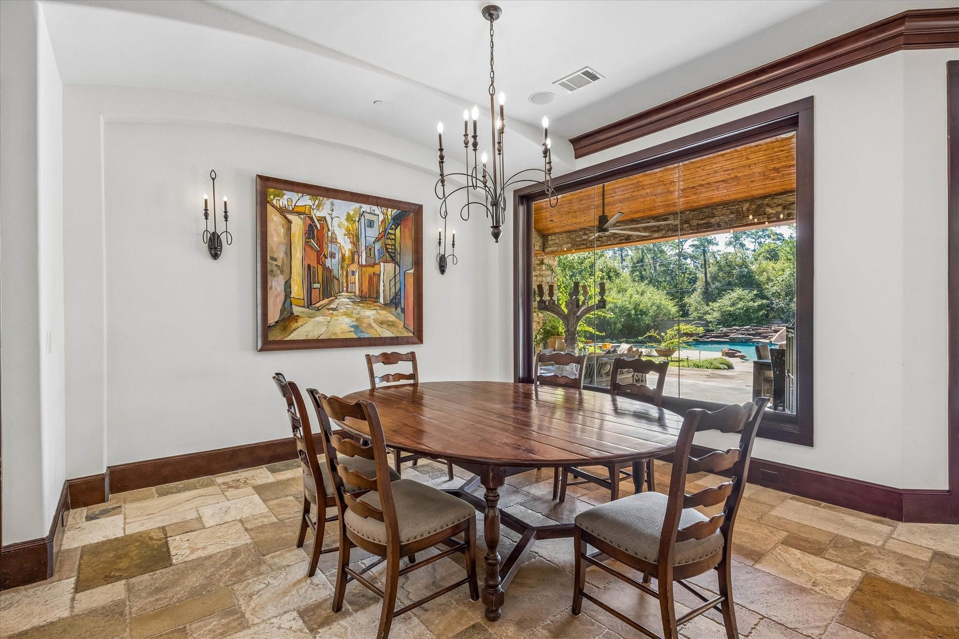 34 Liberty Bell Circle, Bunker Hill Village, TX 77024 The breakfast room offers a relaxed setting for everyday dining, with subtle ceiling details and a large picture window overlooking the covered patio and resort-style pool.