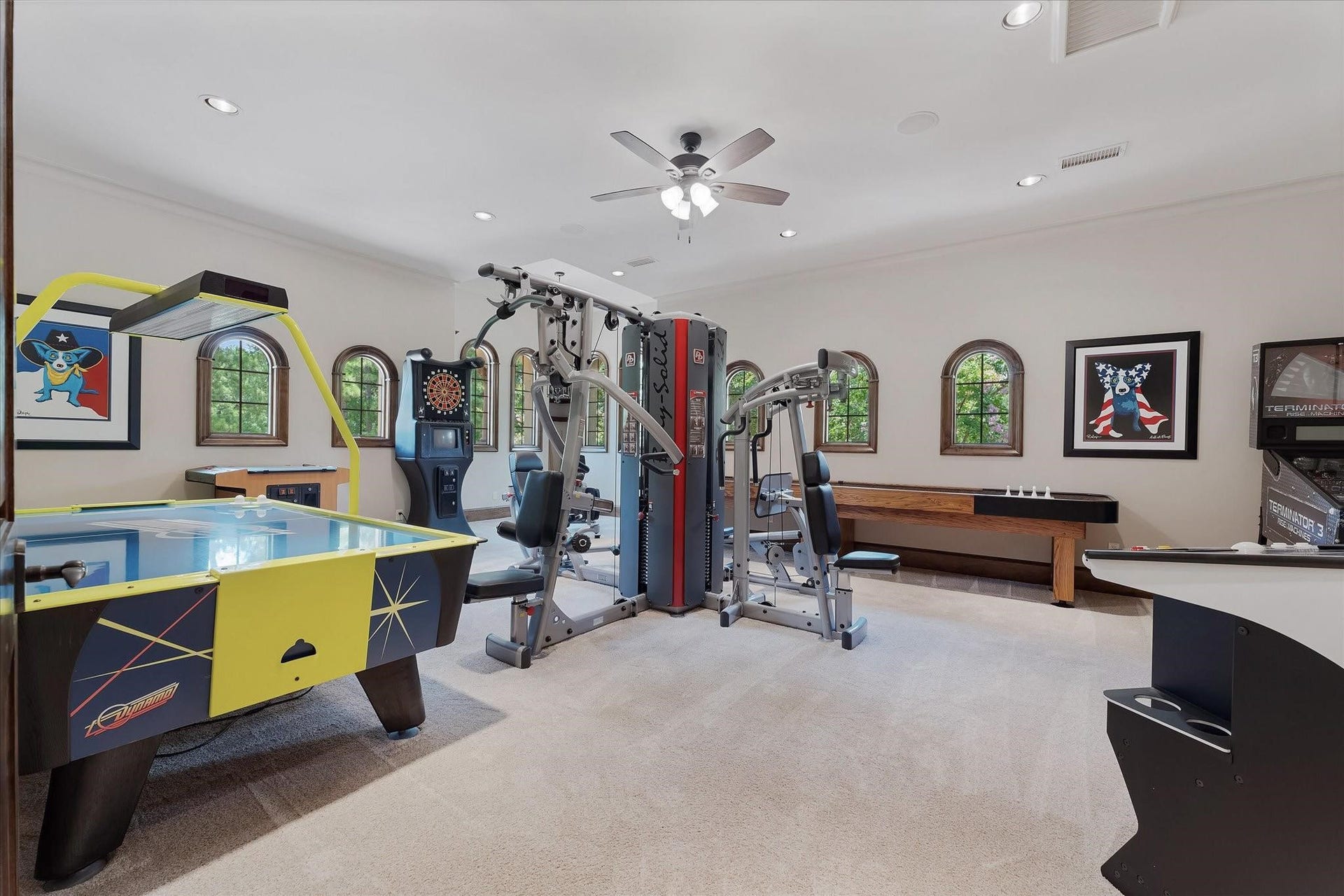 28322 Meadow Forest, Magnolia, TX 77355 Large game room just off the theater and bar and entertainment space with custom built-ins with cabinets, walk-in closet built-ins.