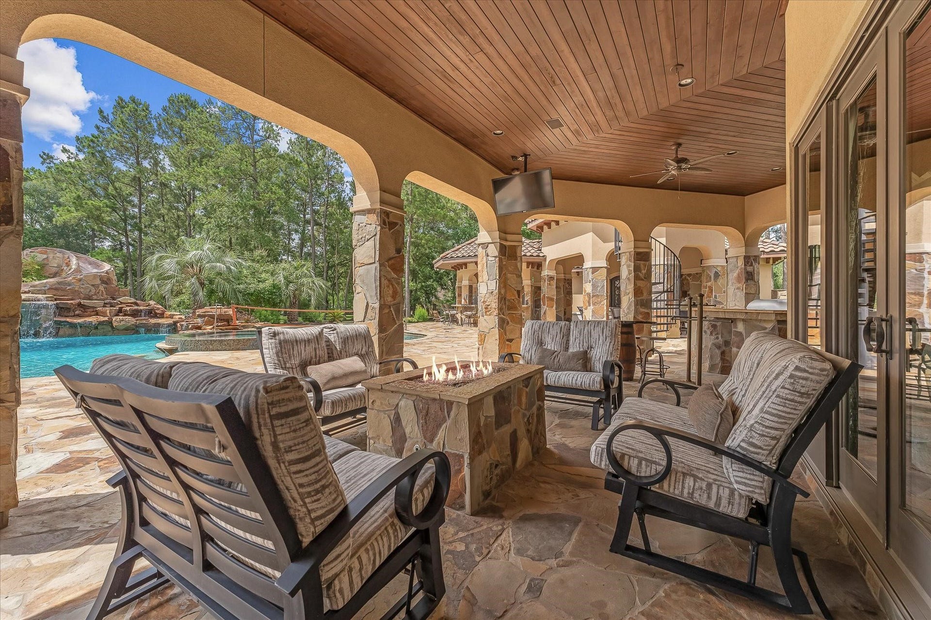 28322 Meadow Forest, Magnolia, TX 77355 Summer Kitchen With Granite Countertop, Gas Grill With Side Burner, Sink, and outdoor fridge. Access
to a full outdoor dauh.