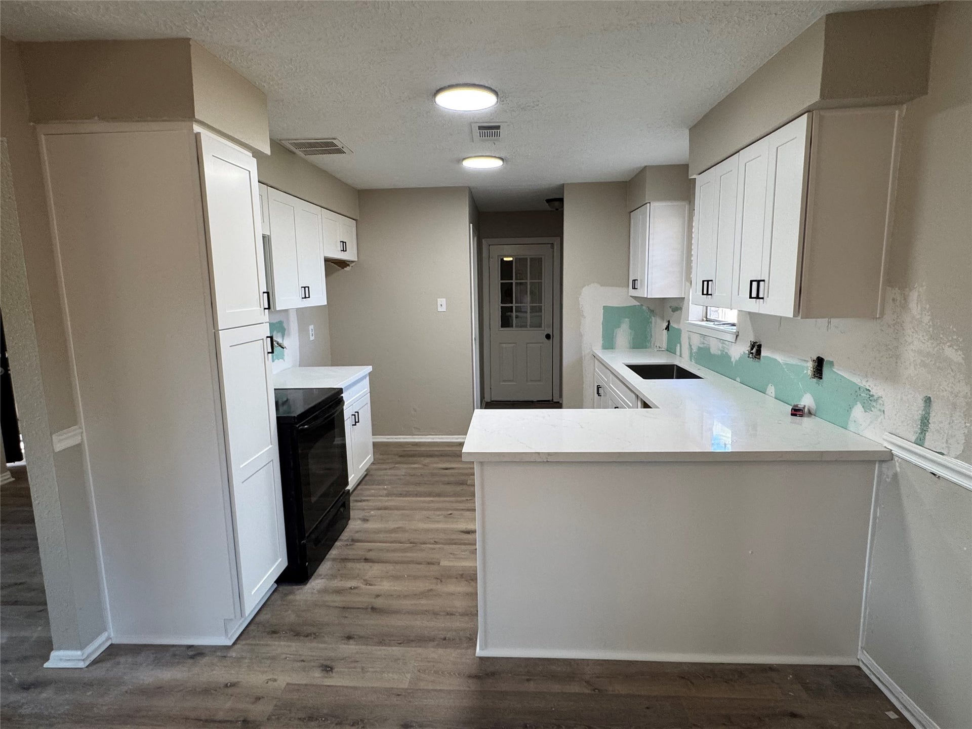 6128 Creekside Lane, League City, TX 77573 kitchen is being finished. cabinets and counters installed